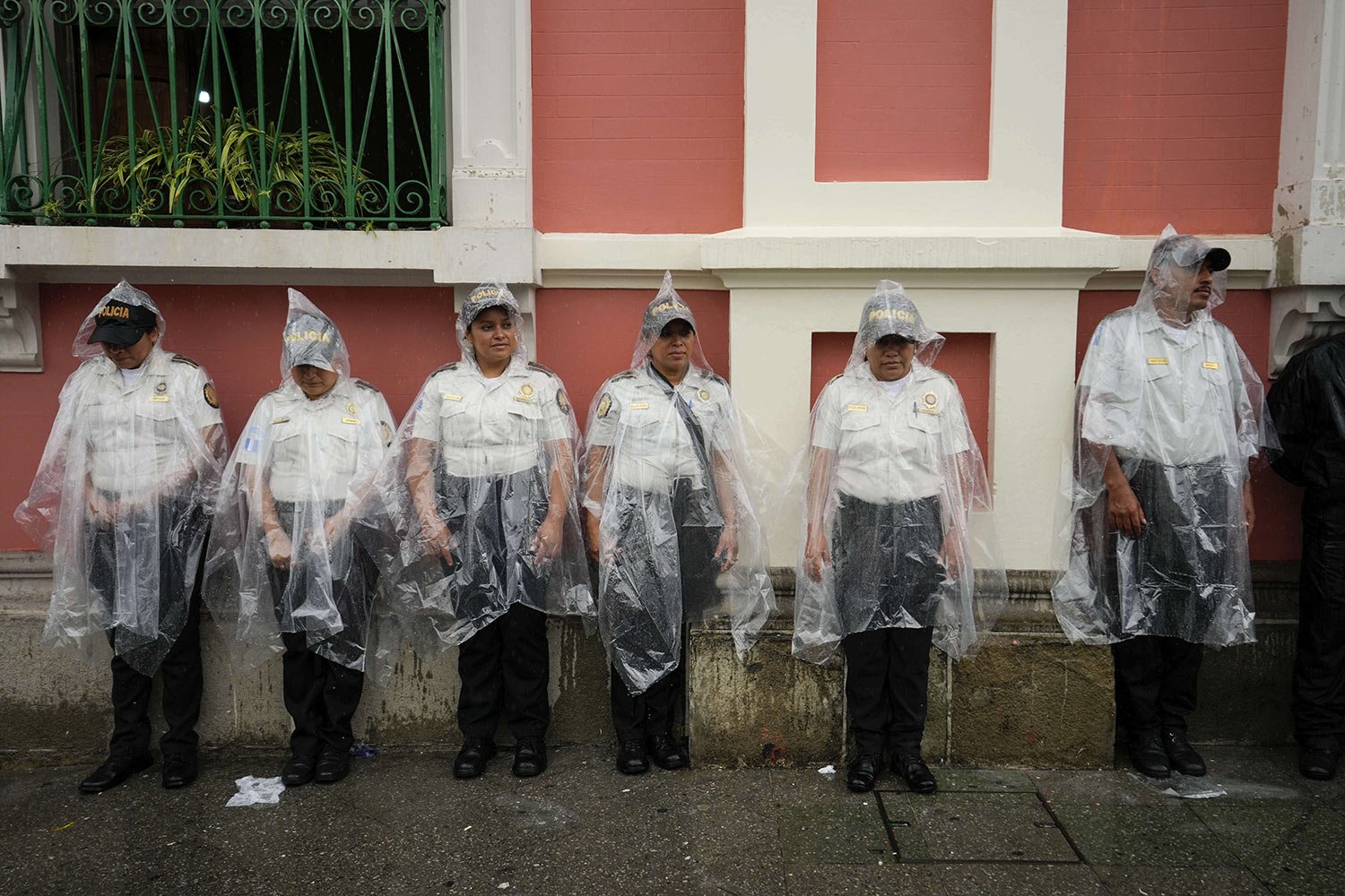  Police stand guard outside the Electoral Court building while demonstrators march to support the electoral process, as the chief justice of the Supreme Court issued an order blocking certification of the presidential election results, in Guatemala C