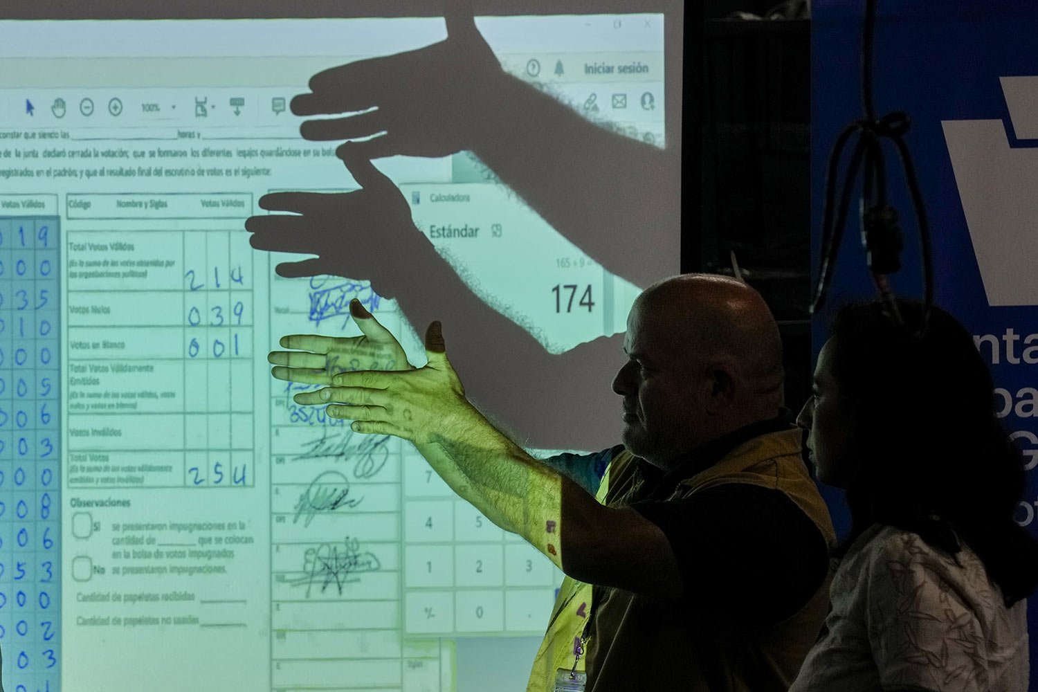  Electoral authorities review electoral records projected on a screen, on the third day of a review of electoral records, in Guatemala City, Thursday, July 6, 2023. The Constitutional Court ordered the investigation of alleged irregularities claimed 
