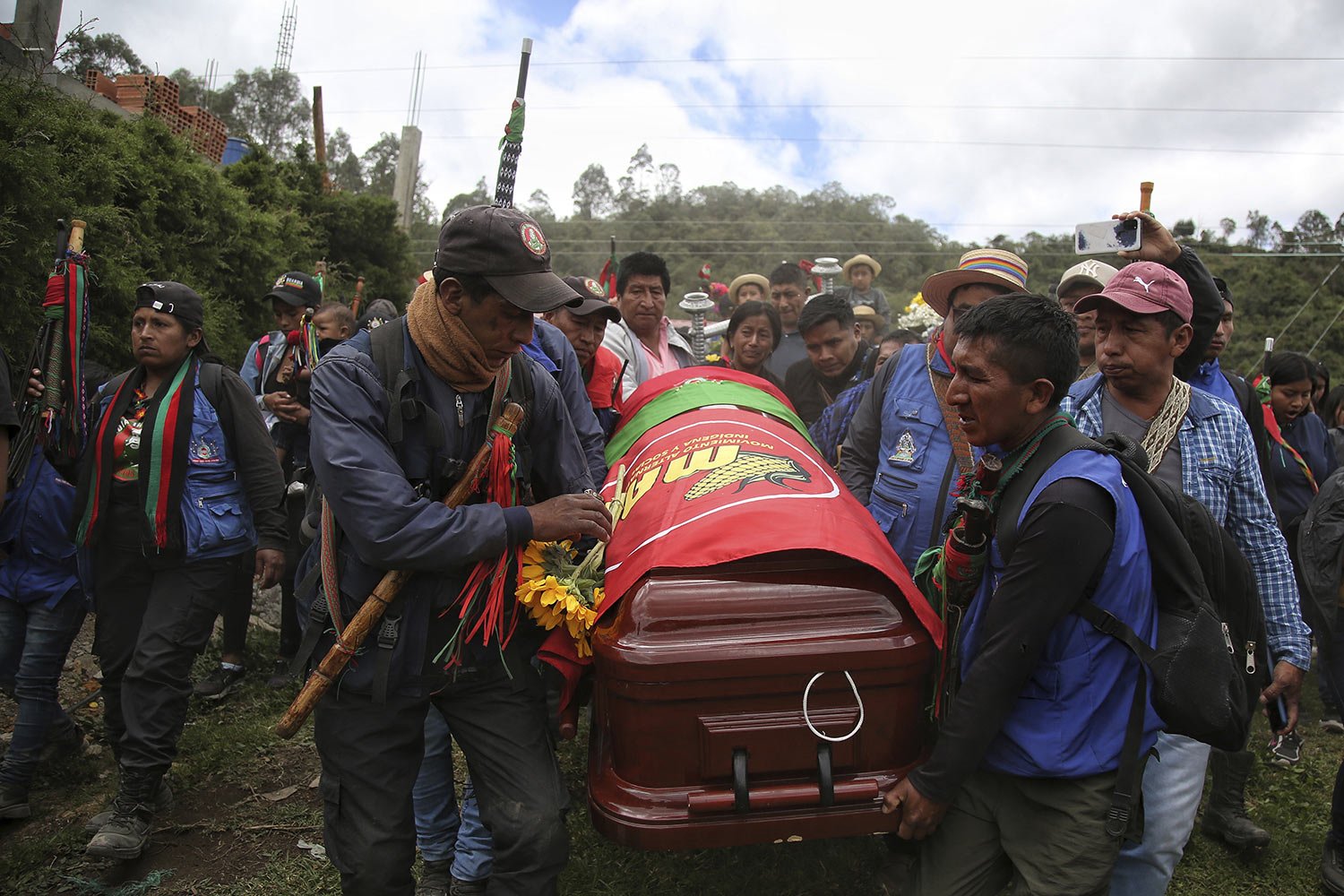  Pallbearers carry the coffin that contain the remains of Indigenous regional leader Fredy Campo Bomba, in Caldono, Colombia, Saturday, July 29, 2023. Campo Bomba was killed by unidentified gunmen on July 26. (AP Photo/Andres Quintero) 