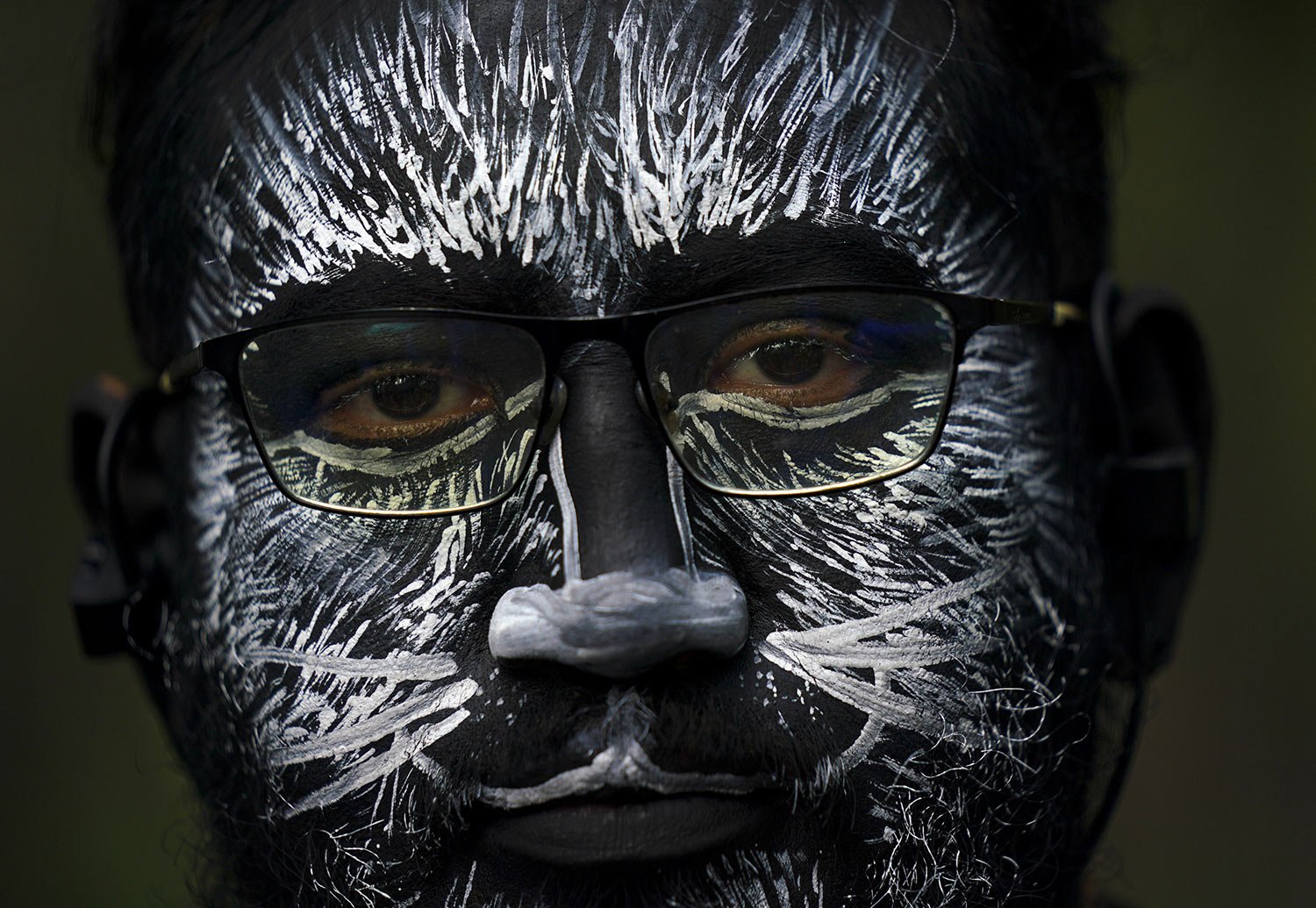  A visitor, his face painted to represent a zebra, eyes the camera during a parade marking the 100th anniversary of the Chapultepec Zoo, in Mexico City, Thursday, July 6, 2023. (AP Photo/Fernando Llano) 