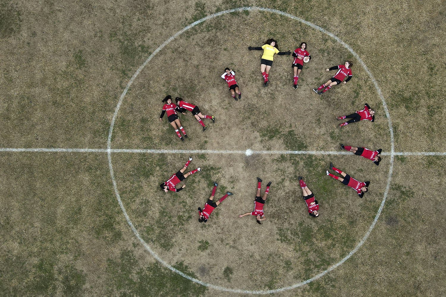  Huracan de Chabas women’s soccer team pose for photos on the field prior to their match against Alumni in Arequito, Santa Fe province, Argentina, Monday, June 19, 2023.  (AP Photo/Natacha Pisarenko) 