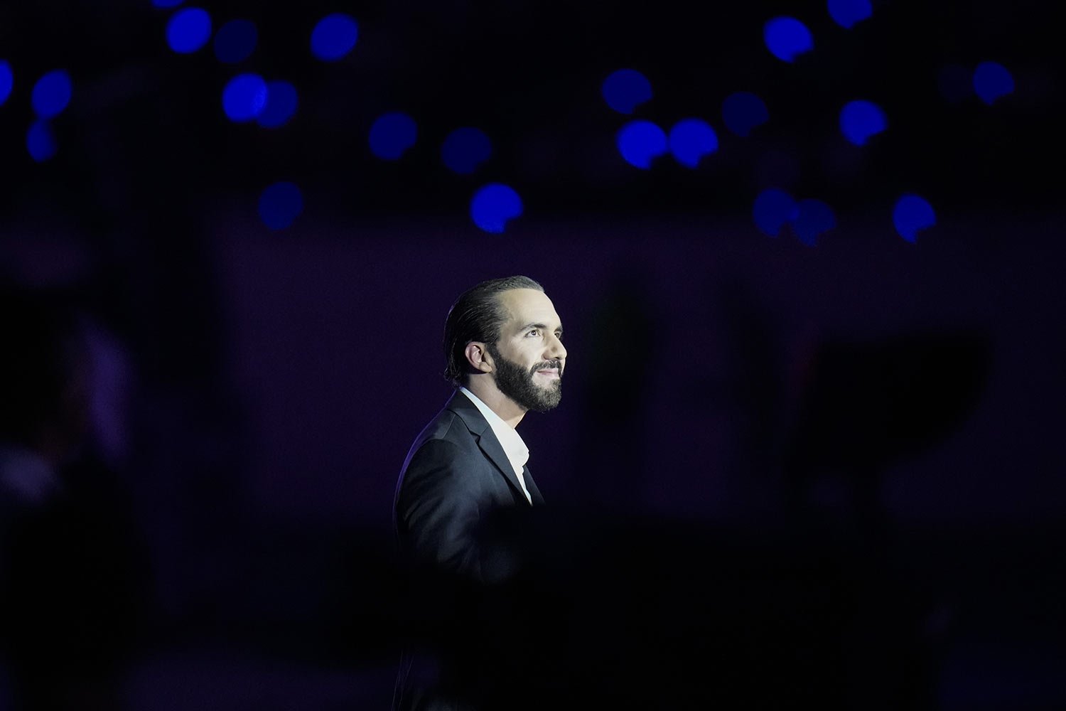  Salvadoran President Nayib Bukele is illuminated by a stage spotlight during the Central American and Caribbean Games opening ceremony, at the newly remodeled Jorge "El Magico" Gonzalez stadium in San Salvador, El Salvador, June 23, 2023.  The 41-ye