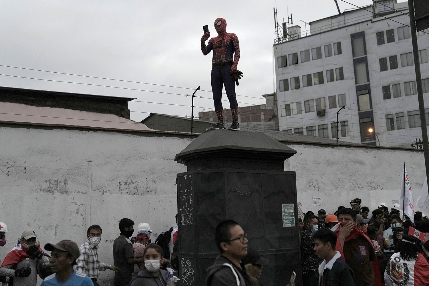  An anti-government protester dressed as Spiderman takes photos during a march through downtown Lima, Peru, Wednesday, July 19, 2023. (AP Photo/Rodrigo Abd) 