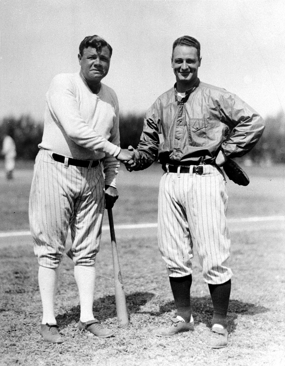  New York Yankees players Babe Ruth, left, and Lou Gehrig shake hands at the Yankee training camp at St. Petersburg, Fla., March 14, 1933.  Gehrig, first baseman, is signed up with the clubhouse, but Ruth has yet to have his salary approved by owner 