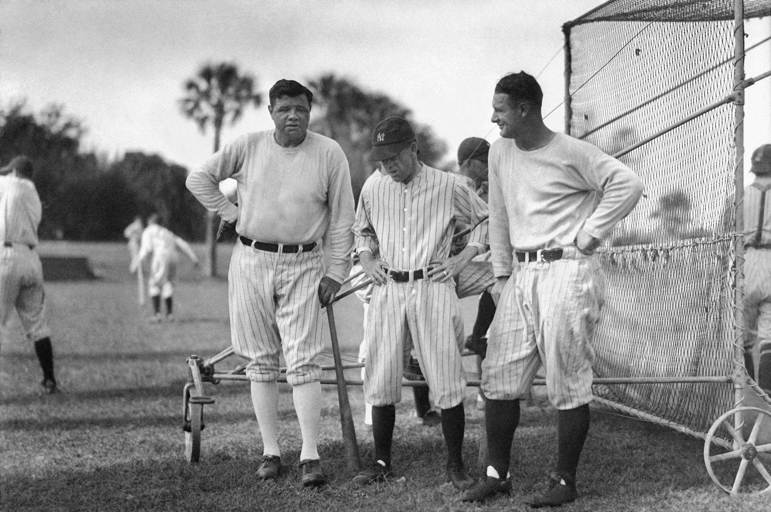  New York Yankees manager Miller Huggins, center, talks with his two most potent offensive weapons, sluggers Babe Ruth, left, and Lou Gehrig, at the batting cage during spring training in Florida in the late 1920s. In 1925 Huggins suspended and fined