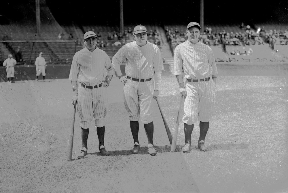  Home run king Babe Ruth of the New York Yankees, center, is seen with teammates Tony Lazzeri, left, and Lou Gehrig, right, June 1927 in New York.  (AP Photo) 