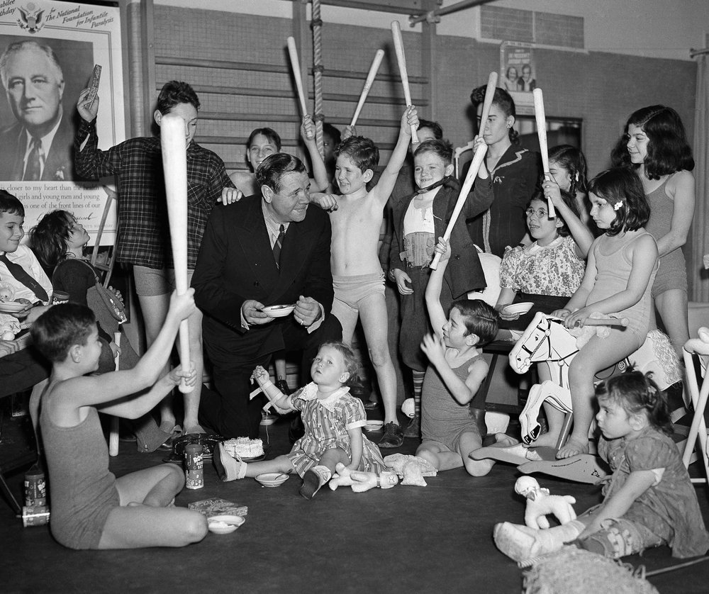  Young infantile paralysis victims cheer Babe Ruth as the slugger visits on Dec. 12, 1941, in New York's Hospital for Joint Diseases. (AP Photo) 