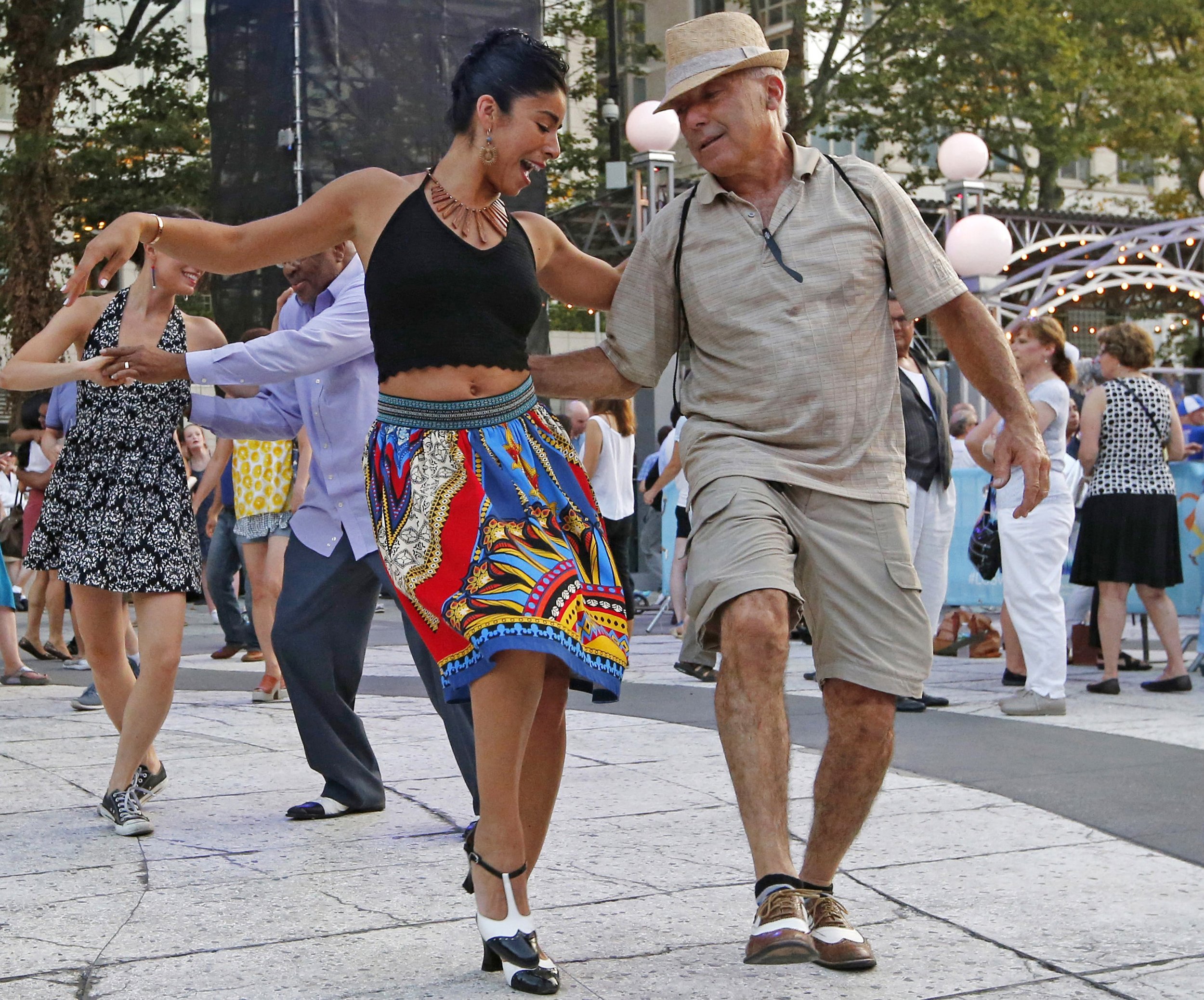  Sherise Cortez of New York City and Bill Ragona of Long Island, NY., dance to the music of Midsummer Night Swing, an outdoor summer dance series that includes big band music, Lindy hop, salsa, hustle, Charleston, tango, and more in Lincoln Center's 