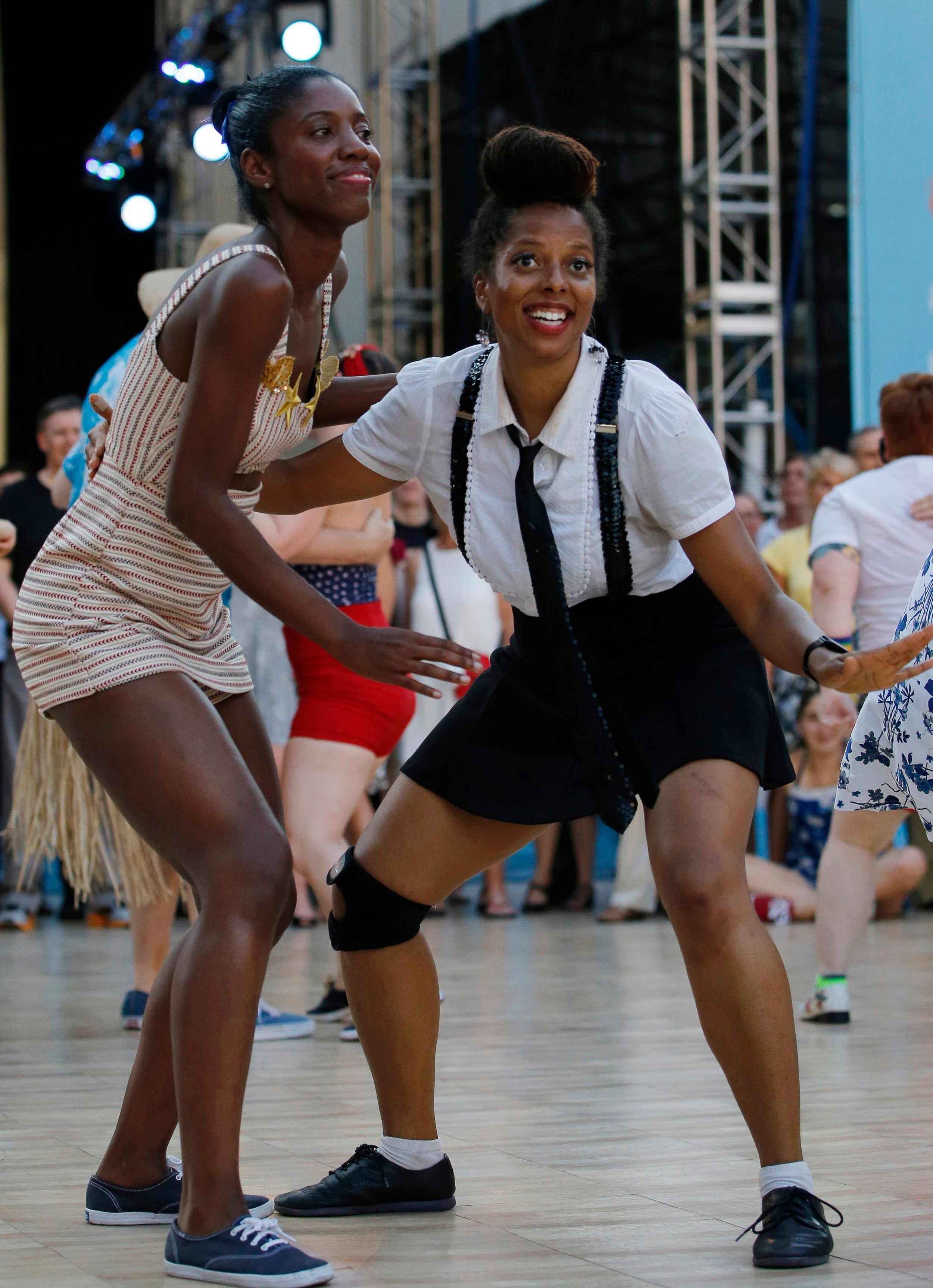  Two young women from the Brooklyn Bombshells, a Brooklyn-based dance group, perform on the dance floor during Midsummer Night Swing, an outdoor public dance series at Lincoln Center's Damrosch park, Wednesday, July 6, 2016, in New York. The women jo