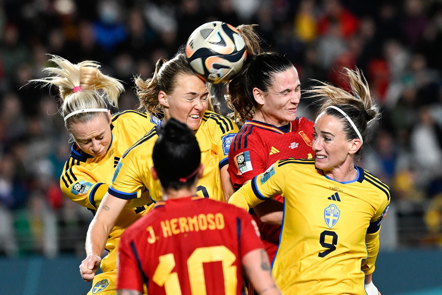 Player compete to head the ball during the Women's World Cup semifinal soccer match between Sweden and Spain at Eden Park in Auckland, New Zealand, Tuesday, Aug. 15, 2023. (AP Photo/Andrew Cornaga)