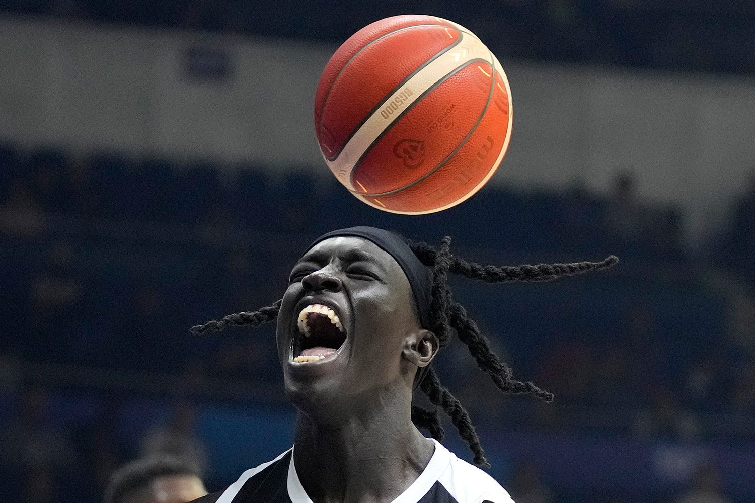  South Sudan center Deng Acuoth reacts after scoring against Angola during their Basketball World Cup classification match at the Araneta Coliseum in Manila, Philippines on Saturday Sept. 2, 2023. (AP Photo/Aaron Favila) 
