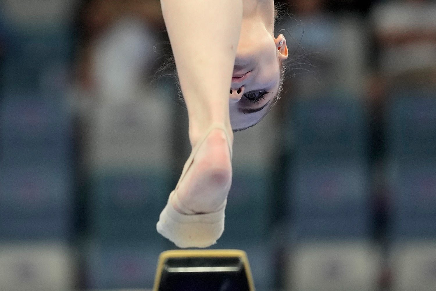  Darya Yassinskaya of Kazakhstan competes on the balance beam at the women's team artistic gymnastics event of the 19th Asian Games in Hangzhou, China, Monday, Sept. 25, 2023. (AP Photo/Aaron Favila) 