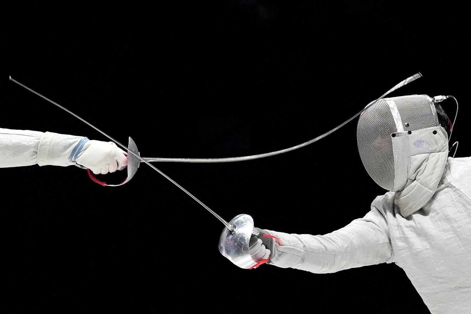  Shen Chenpeng, left, of China, competes against Gu Bongil of South Korea during the men's sabre team finals match of the 19th Asian Games in Hangzhou, China, Thursday, Sept. 28, 2023. (AP Photo/Aaron Favila) 