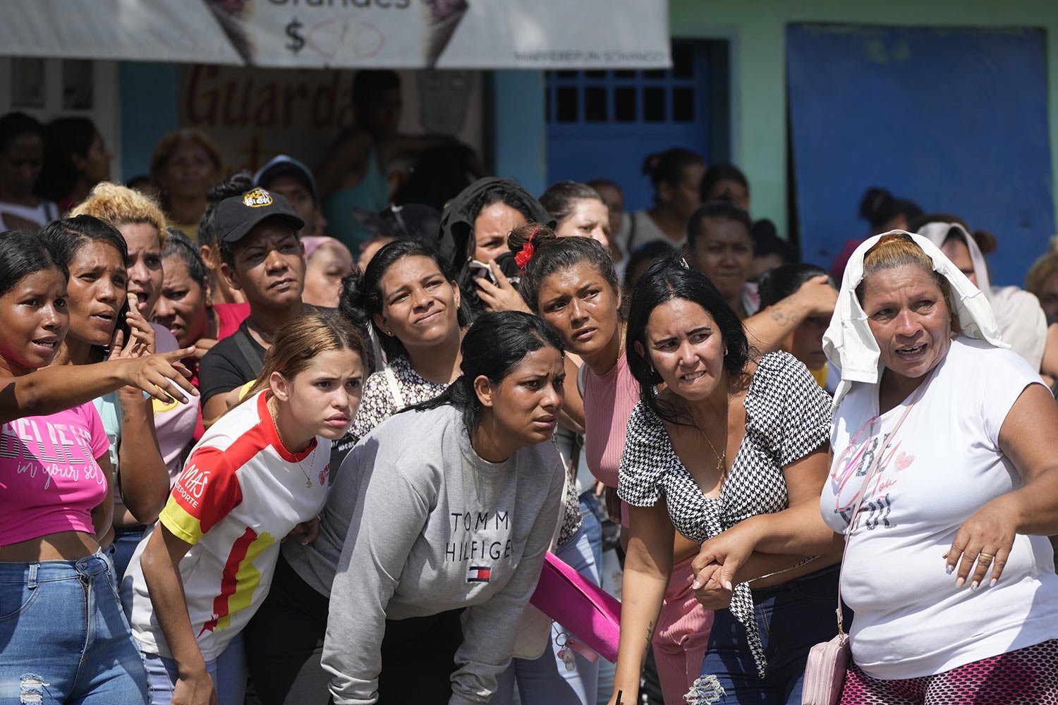  Family members of inmates watch soldiers raid the Penitentiary Center in Tocorón, Venezuela, Sept. 20, 2023. Soldiers carried out the raid to dismantle a criminal gang, according to authorities. (AP Photo/Ariana Cubillos) 