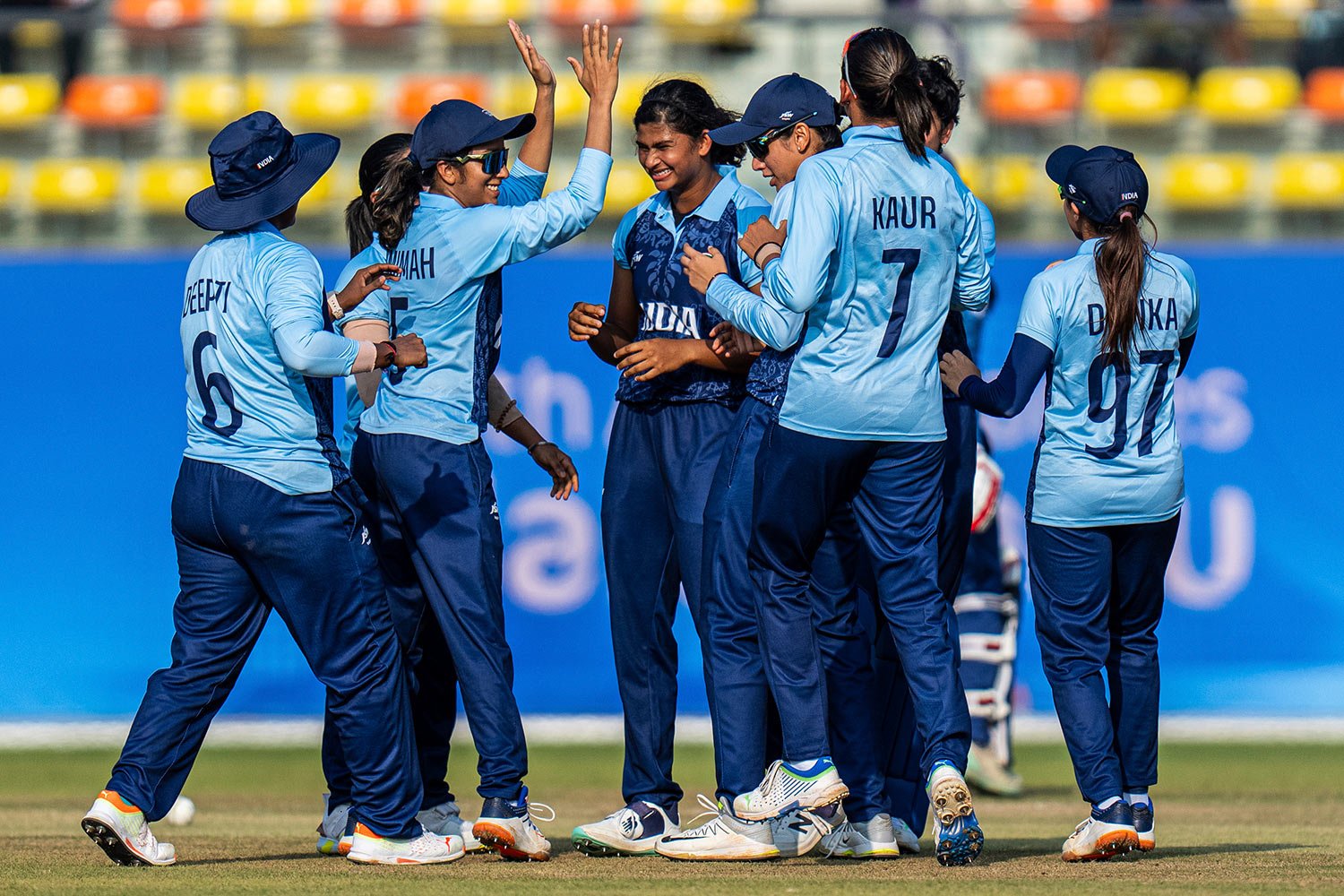  India's players celebrate during the women's final cricket match between Sri Lanka and India at the 19th Asian Games in Hangzhou, China, Monday, Sept. 25, 2023. (AP Photo/Louise Delmotte) 