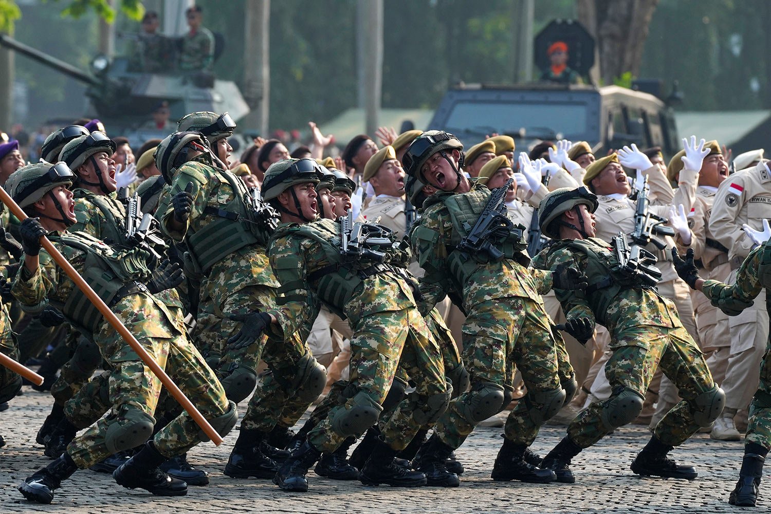 Soldiers perform during a parade marking the 78th anniversary of the Indonesian Armed Forces in Jakarta, Indonesia, Thursday, Oct. 5, 2023. (AP Photo/Tatan Syuflana) 
