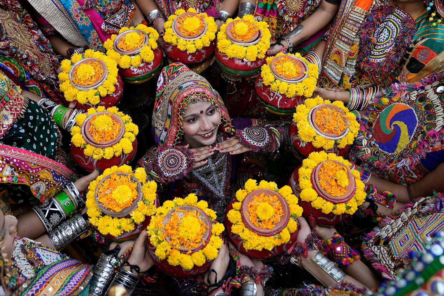  Indians in traditional attire pose for the media as they practice the Garba, a traditional dance of Gujarat state, ahead of Navratri festival in Ahmedabad, India, Monday, Oct. 9, 2023.  (AP Photo/Ajit Solanki) 