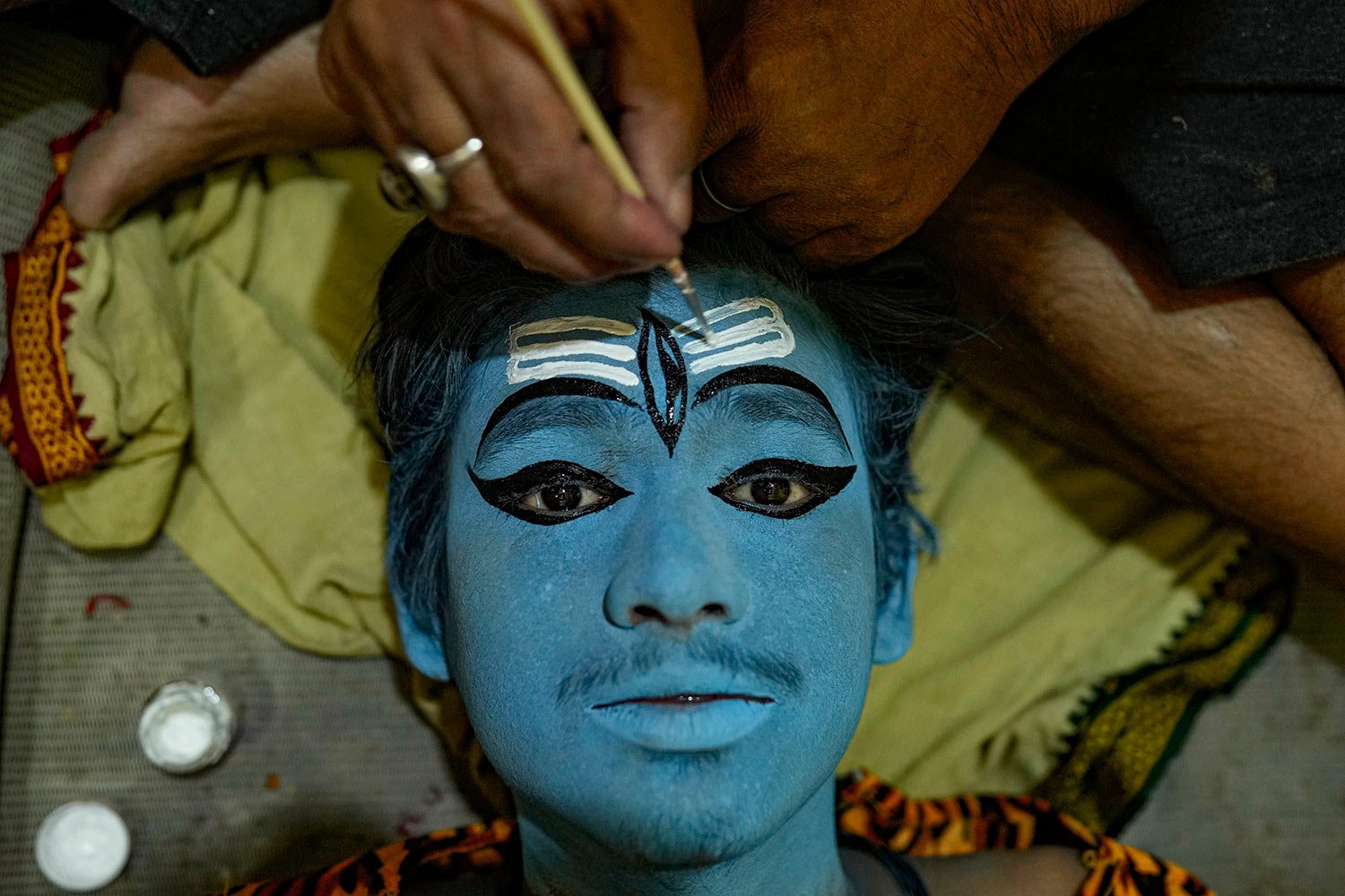 An artist is prepared for a religious procession during Dussehra festival in Prayagraj, India, Thursday, Oct. 19, 2019. (AP Photo/Rajesh Kumar Singh) 