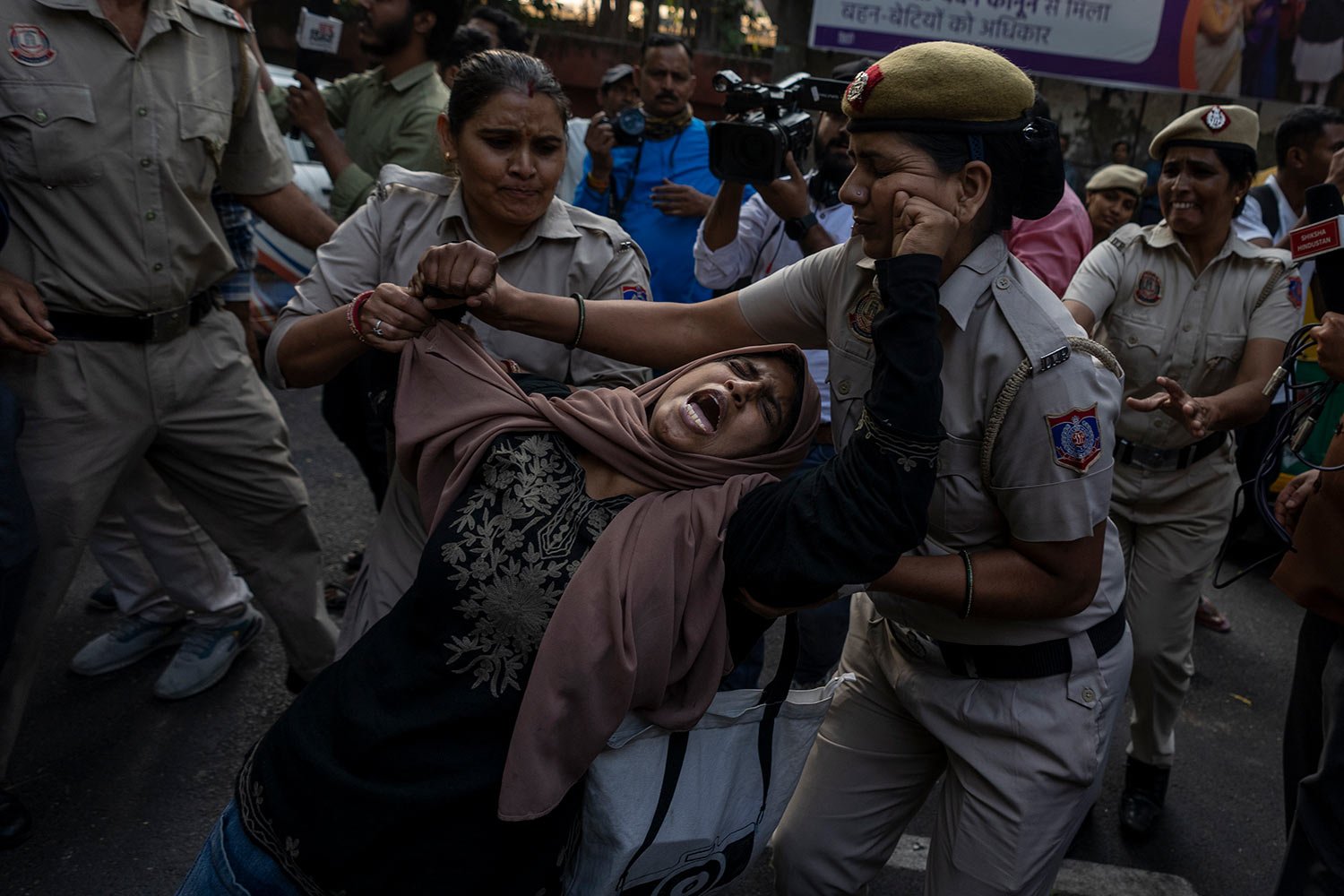 A student activist resists detention while gathering to protest against Israel's military operations in Gaza and to support the Palestinian people, in New Delhi, India, Friday, Oct. 27, 2023. (AP Photo/Altaf Qadri) 