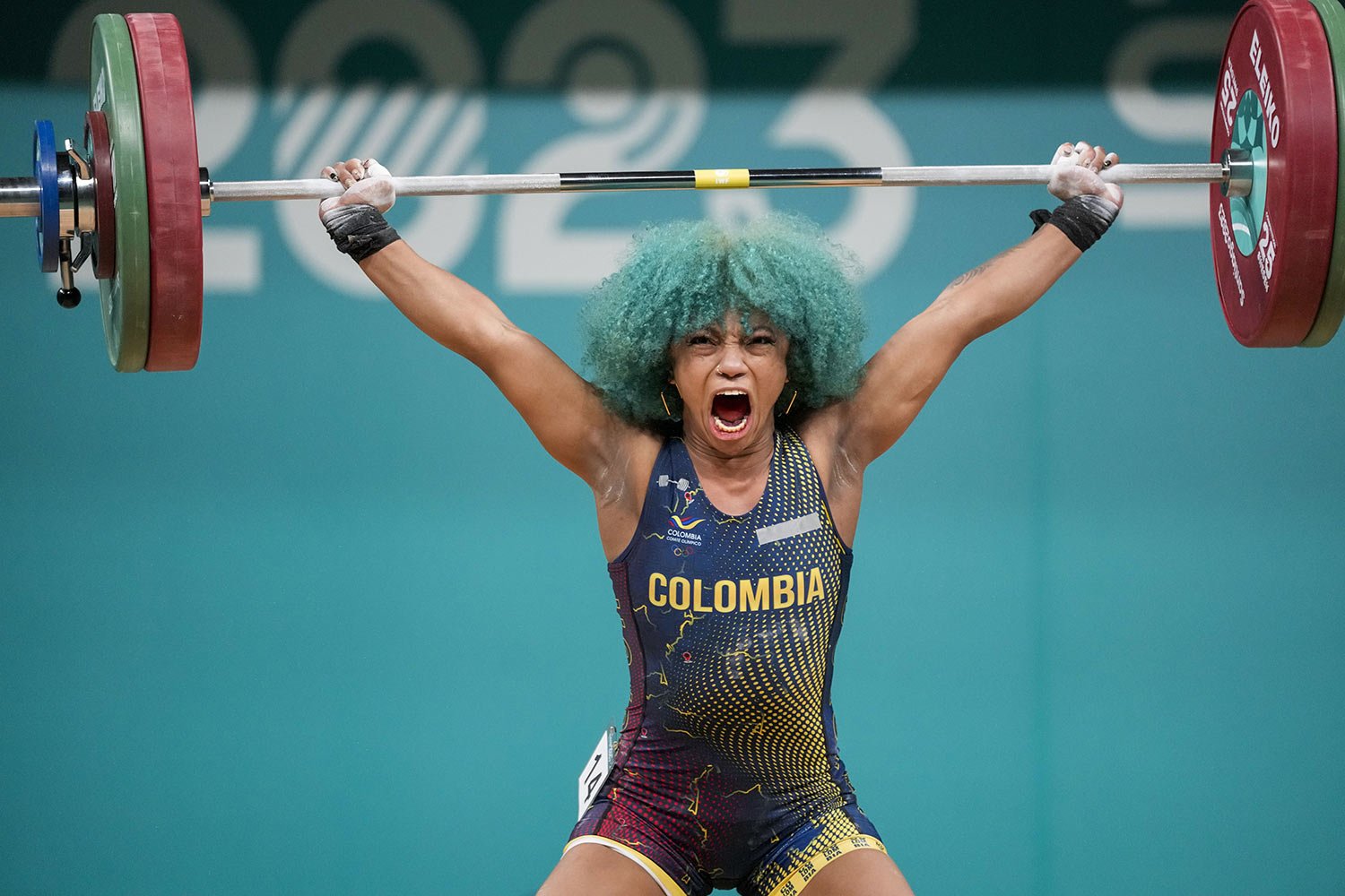  Colombia's Concepcion Usuga competes in women's weightlifting 59Kg at the Pan American Games in Santiago, Chile, Oct. 22, 2023. (AP Photo/Moises Castillo) 