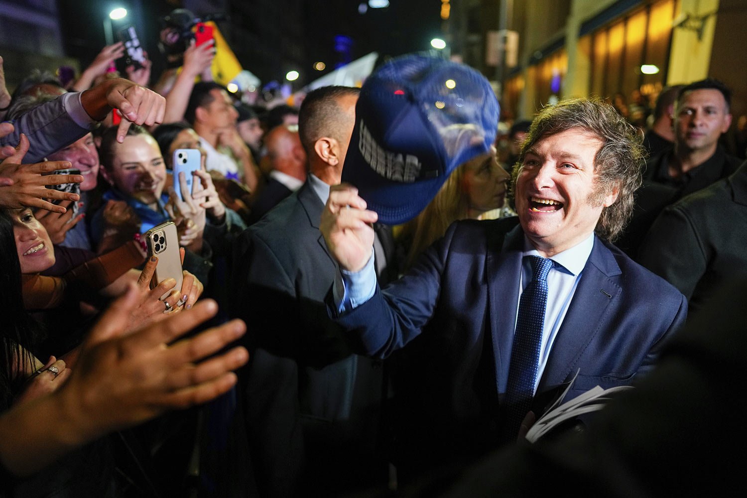 Presidential candidate Javier Milei greets supporters at his campaign headquarters after polls closed for general elections in Buenos Aires, Argentina, Oct. 22, 2023. (AP Photo/Natacha Pisarenko) 