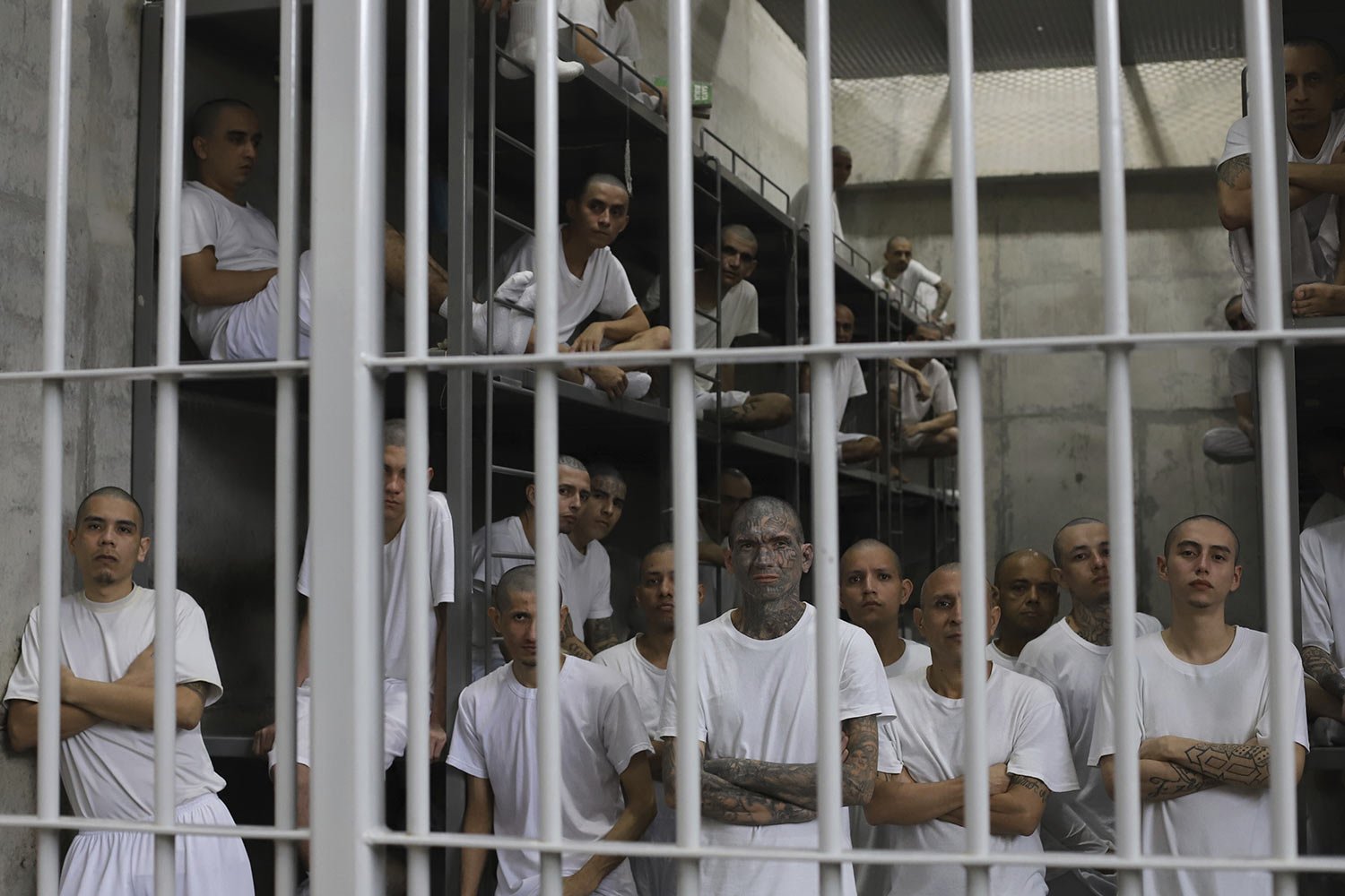  Inmates attend a class on social behavior from inside their shared cell during a press tour of the Terrorism Confinement Center, a mega-prison in Tecololuca, El Salvador, Oct. 12, 2023. (AP Photo/Salvador Melendez) 