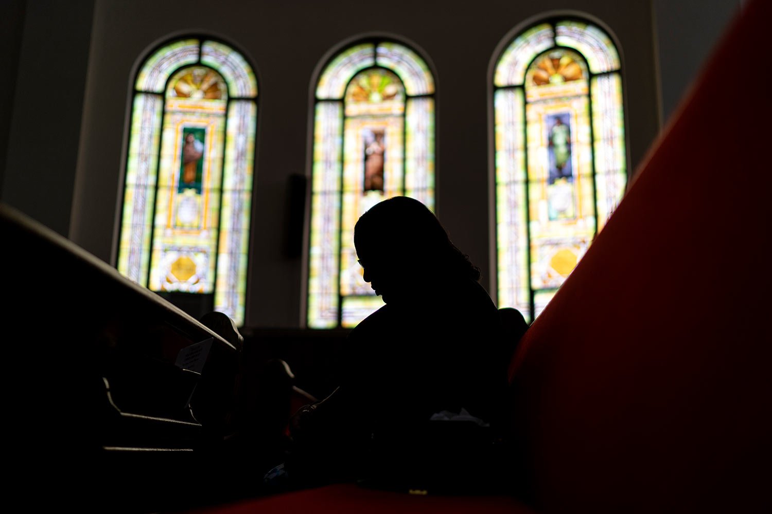  A parishioner prays during a service at Trinity Baptist church Sunday, Aug. 20, 2023, in Niagara Falls, N.Y. (AP Photo/David Goldman)  