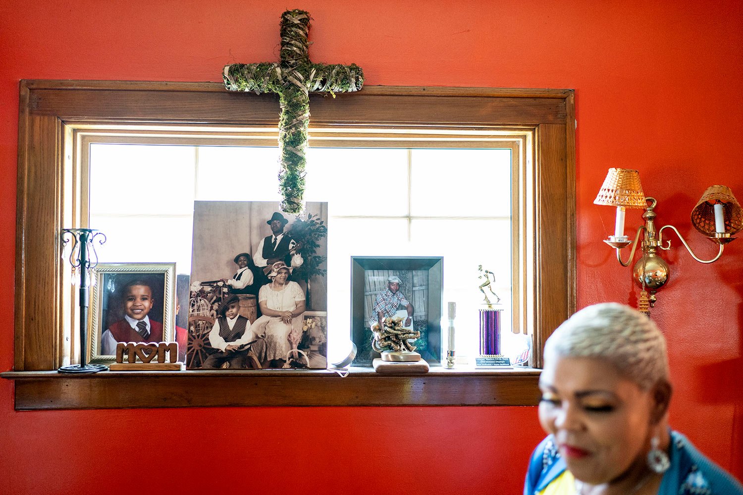  Family photos including a picture of her son, Jaylan, center photo rear, decorate a window in Marsha McWilson’s home, Sunday, Aug. 20, 2023, in Niagara Falls, N.Y.  (AP Photo/David Goldman)  