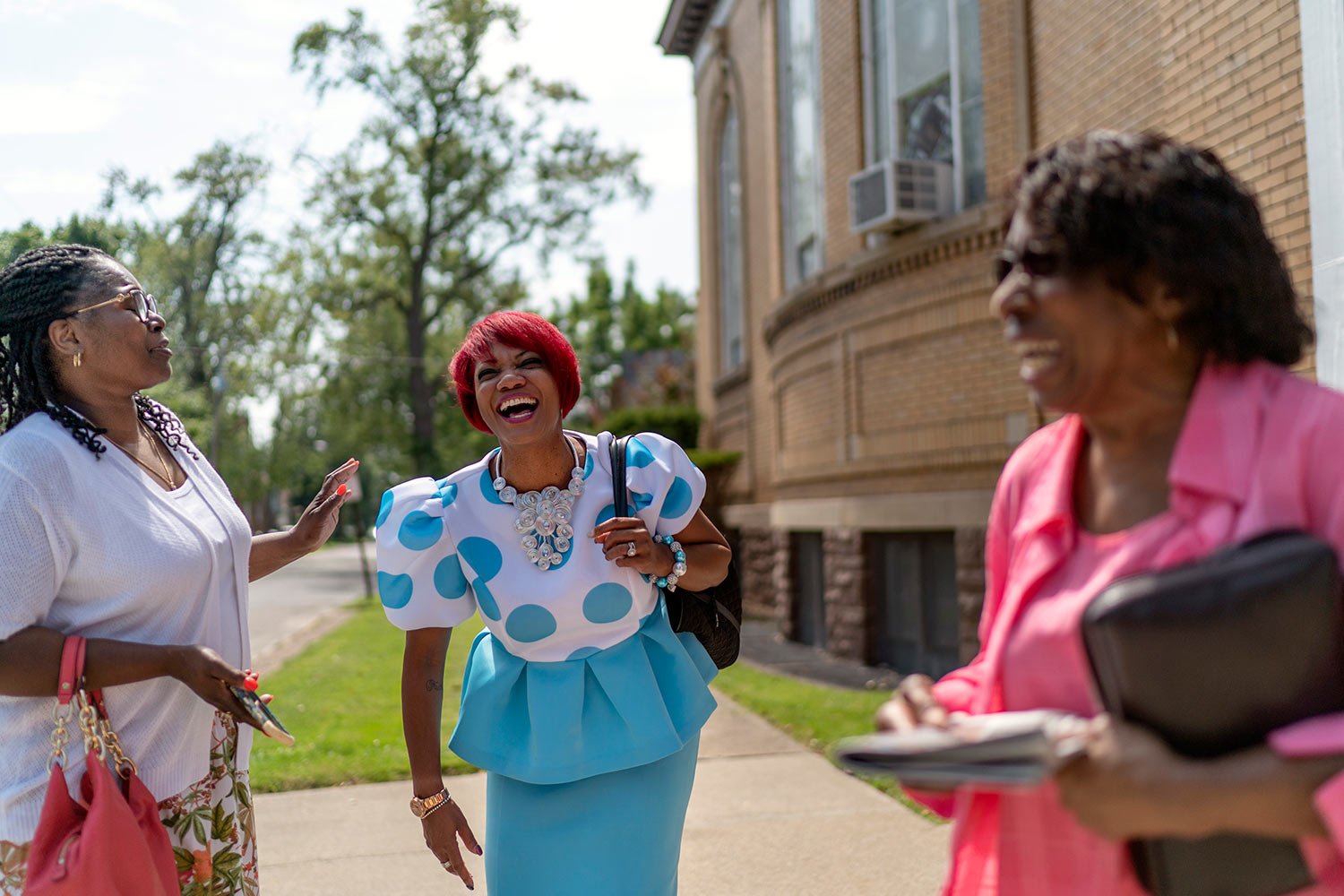  Pastoral assistant, Karen Anderson Hardaway, center, talks with Tameka Felts, left, and Marie Holloman following a service at Trinity Baptist church Sunday, Aug. 20, 2023, in Niagara Falls, N.Y. (AP Photo/David Goldman)  