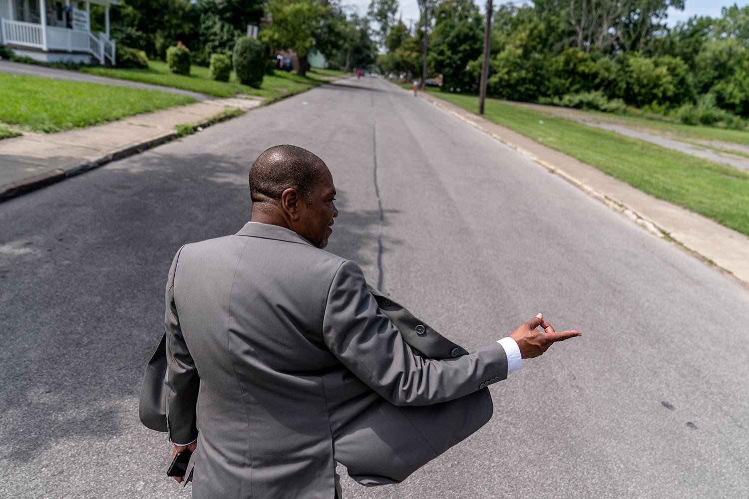  Rev. Jimmie Hardaway Jr. walks through the street outside Trinity Baptist church Sunday, Aug. 20, 2023, in Niagara Falls, N.Y. (AP Photo/David Goldman)  