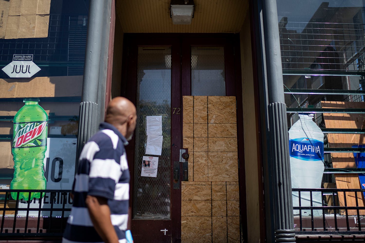  A convenience store is boarded up after the city shut it down in the wake of recent shootings outside the shop in Rochester, N.Y., Tuesday, Aug. 22, 2023. (AP Photo/David Goldman)  