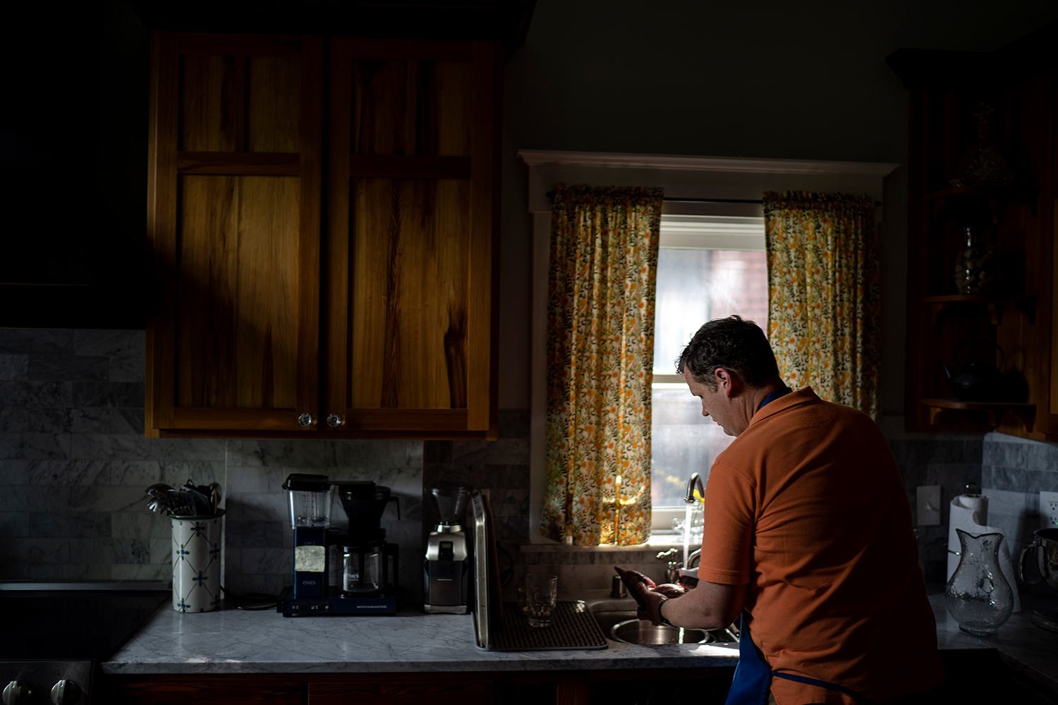  Hollan Holm prepares dinner for his family at his home in Louisville, Ky., Saturday, June 3, 2023. (AP Photo/David Goldman)  