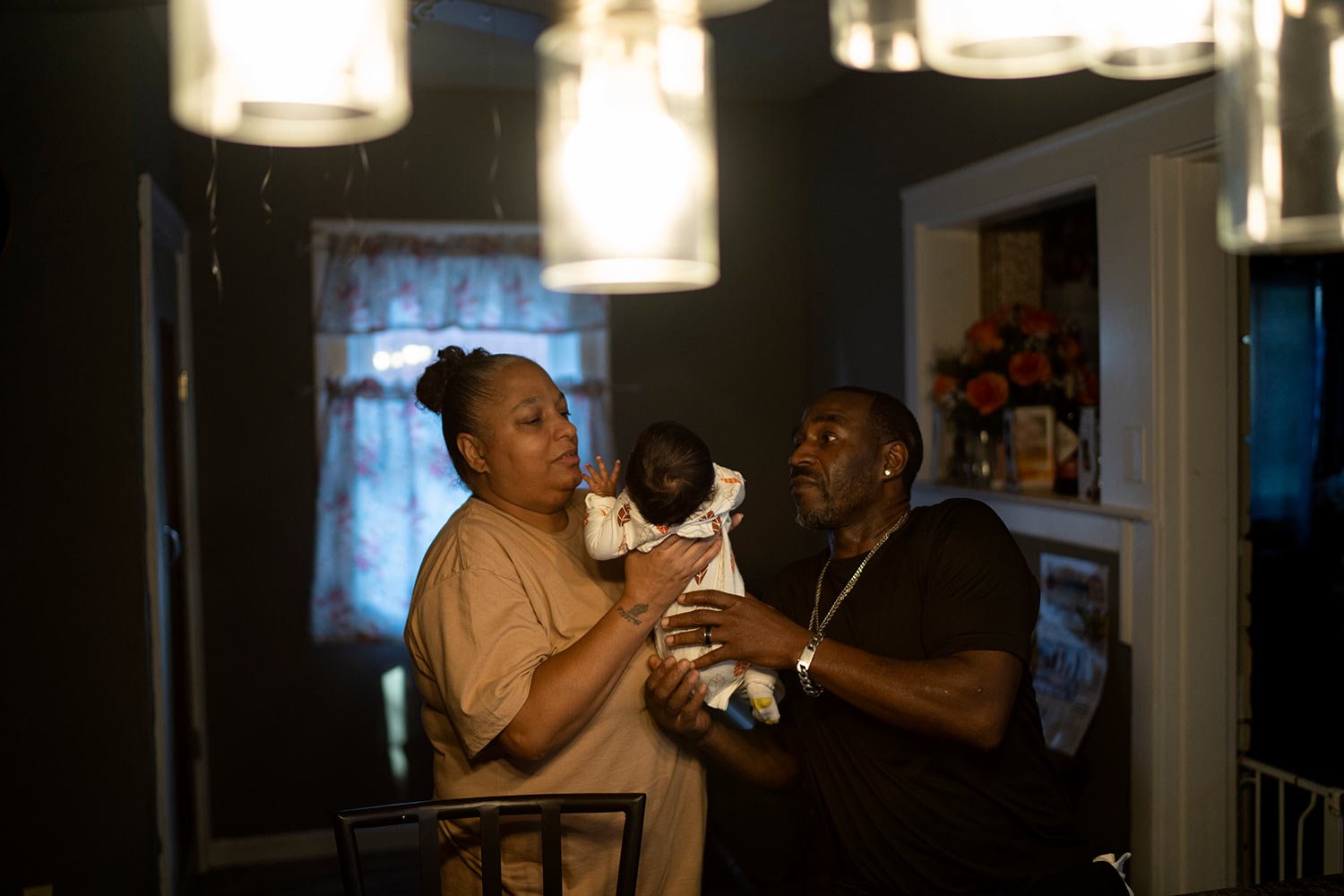  Krista, left, and Navada Gwynn, look after a friend’s baby, two-month-old Katelia, at their home in Louisville, Ky., Tuesday, Aug. 29, 2023.  (AP Photo/David Goldman)  