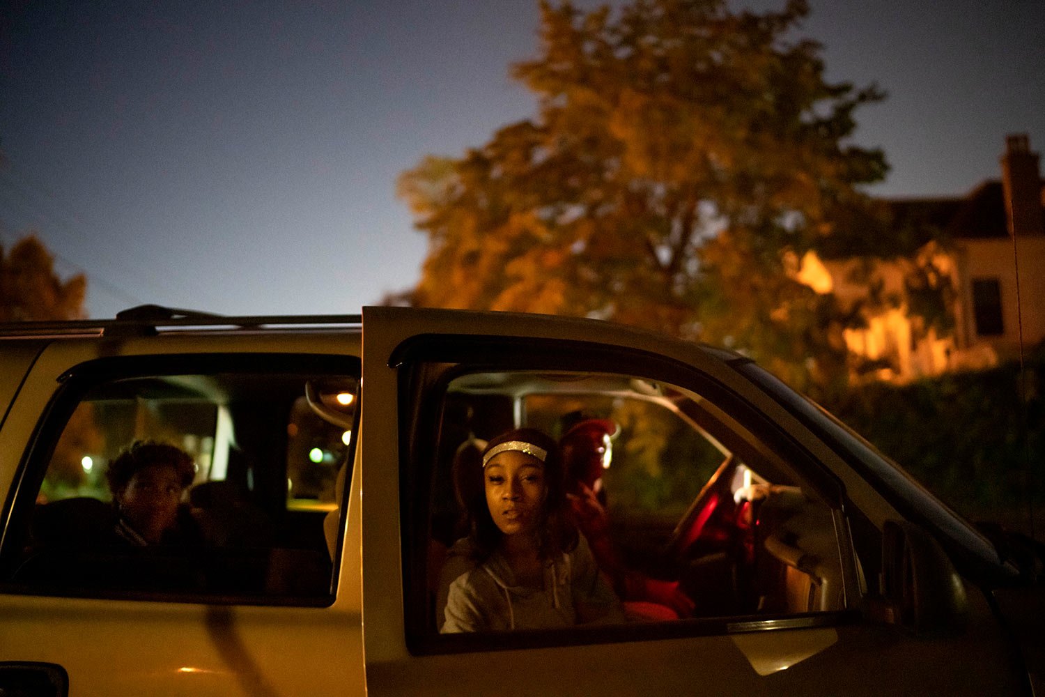  Victoria Gwynn, 21, waits in the car with her father, Navada, right, and sister, also named Nevada, 15, left, for a bus to take her to work at dawn in Louisville, Ky, Tuesday, Aug. 29, 2023. (AP Photo/David Goldman)  