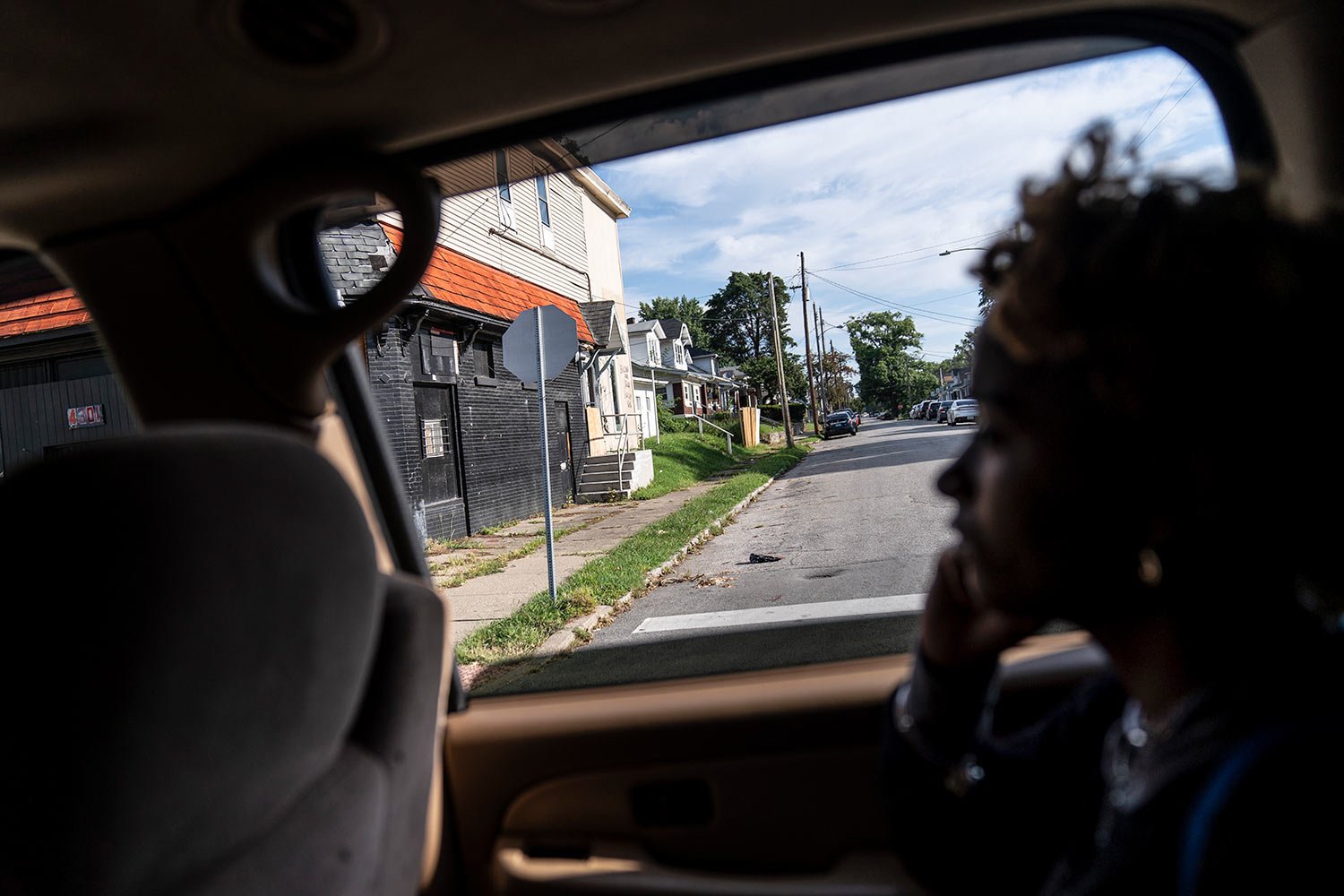  Navada Gwynn, 15, looks out the car window as she rides past the intersection where her brother, Christian, was shot and killed in 2019 just blocks from their home in Louisville, Ky., Tuesday, Aug. 29, 2023, (AP Photo/David Goldman)  