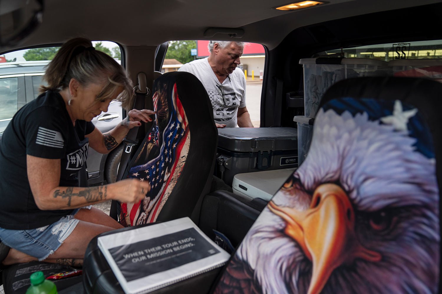  Barbie, left, and Robert Rohde, stock up on supplies while heading to a festival to volunteer for Mission-22, a nonprofit that aims to end military and veteran suicide, Saturday, June 10, 2023, in Jacksonville, Texas. (AP Photo/David Goldman)  