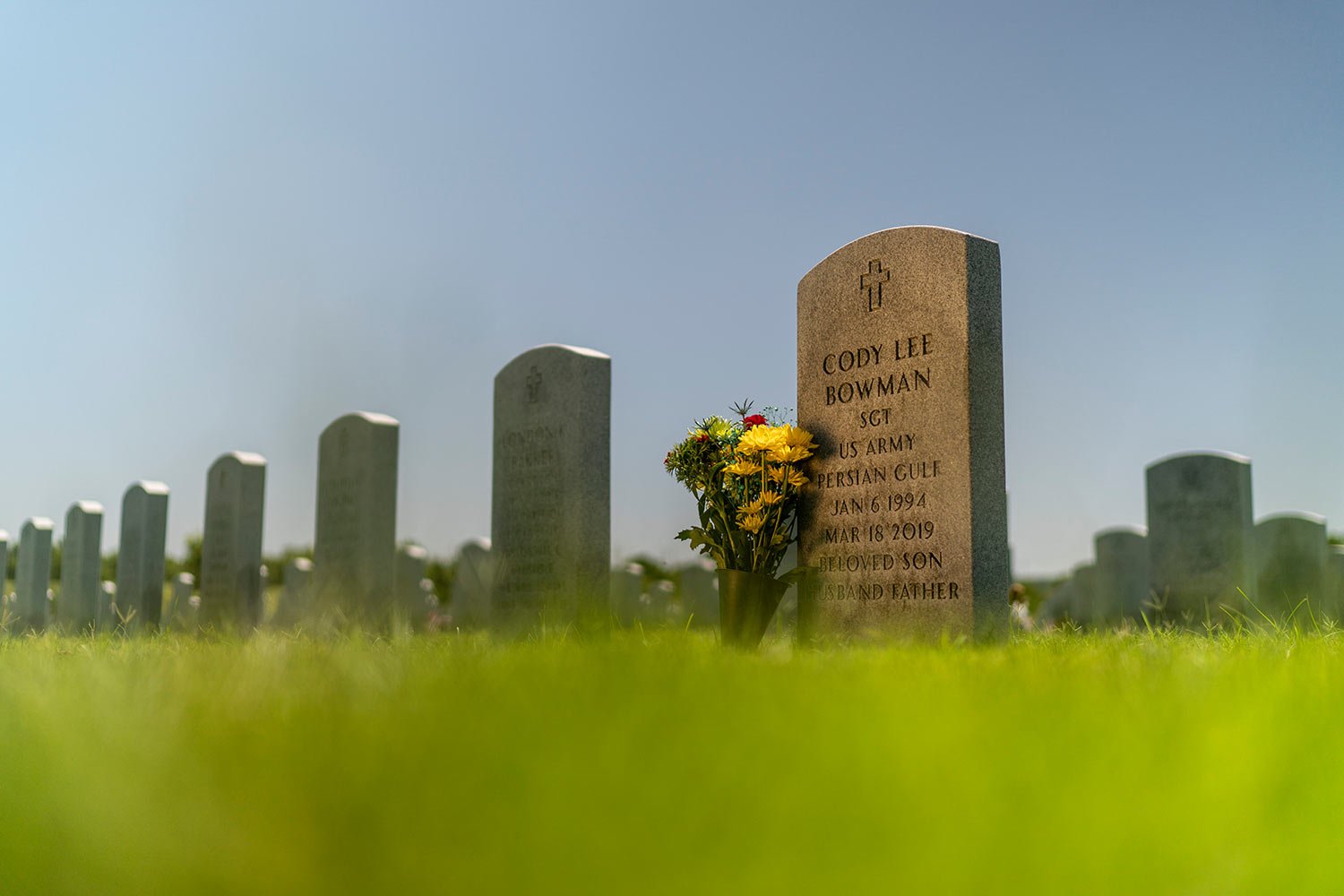  The tombstone of Army Sgt. Cody Bowman stands at the Dallas-Fort Worth National Cemetery, Sunday, June 11, 2023, in Dallas, Texas.  (AP Photo/David Goldman)  