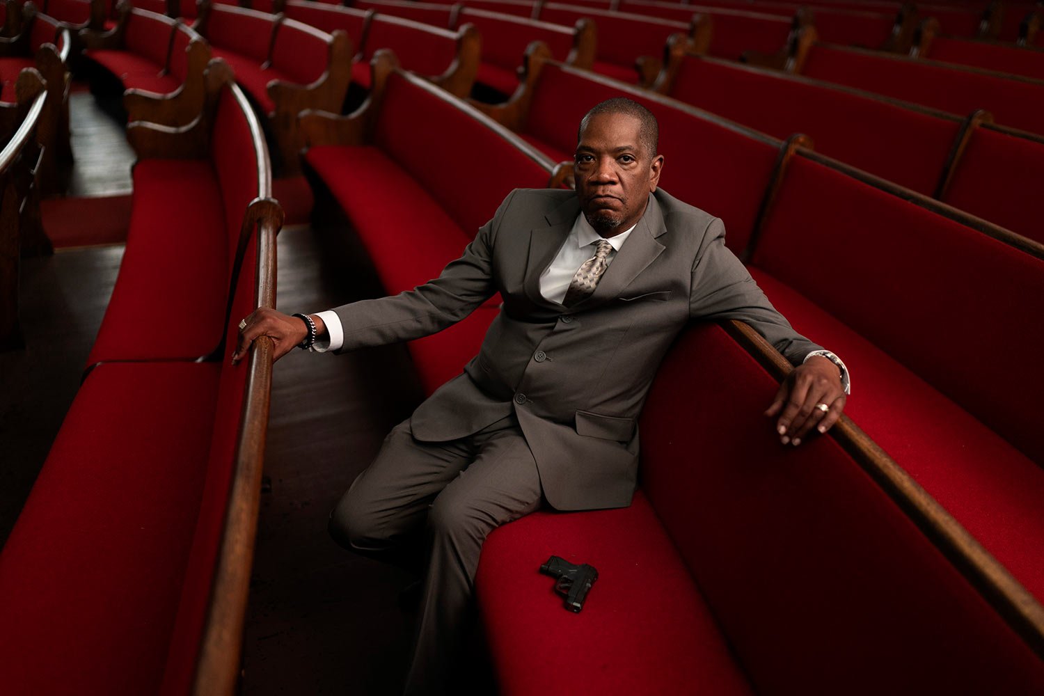  Rev. Jimmie Hardaway Jr. sits for a portrait next to the gun he carries on him during services at Trinity Baptist church Sunday, Aug. 20, 2023, in Niagara Falls, N.Y. (AP Photo/David Goldman)  