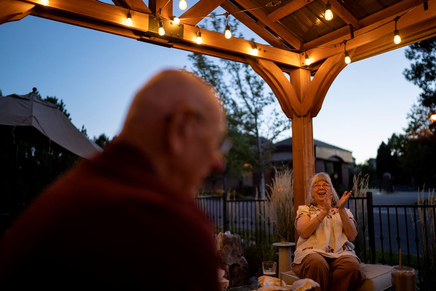  Sandy Phillips, right, laughs while talking with her husband, Lonnie, outside the friend’s home where they’re staying in Lone Tree, Colo., Tuesday, Sept. 5, 2023, during a visit back to the United States. (AP Photo/David Goldman)  