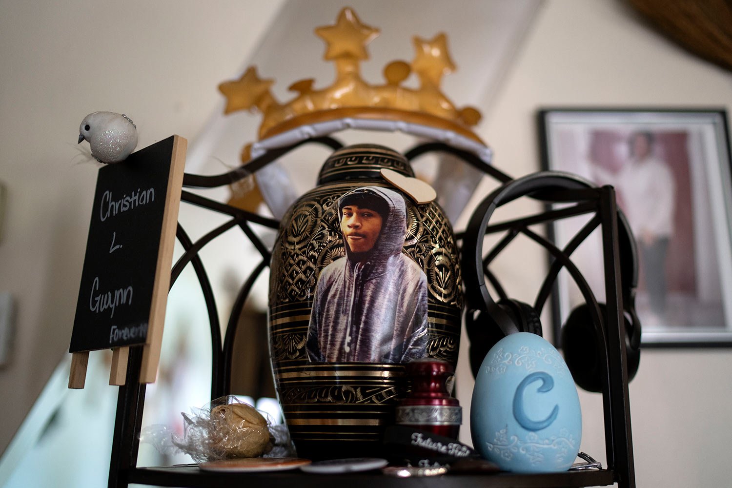  An urn containing the remains of Christian Gwynn sit on a shelf in his family???s home in  Louisville, Ky., Monday, Aug. 28, 2023. (AP Photo/David Goldman)  