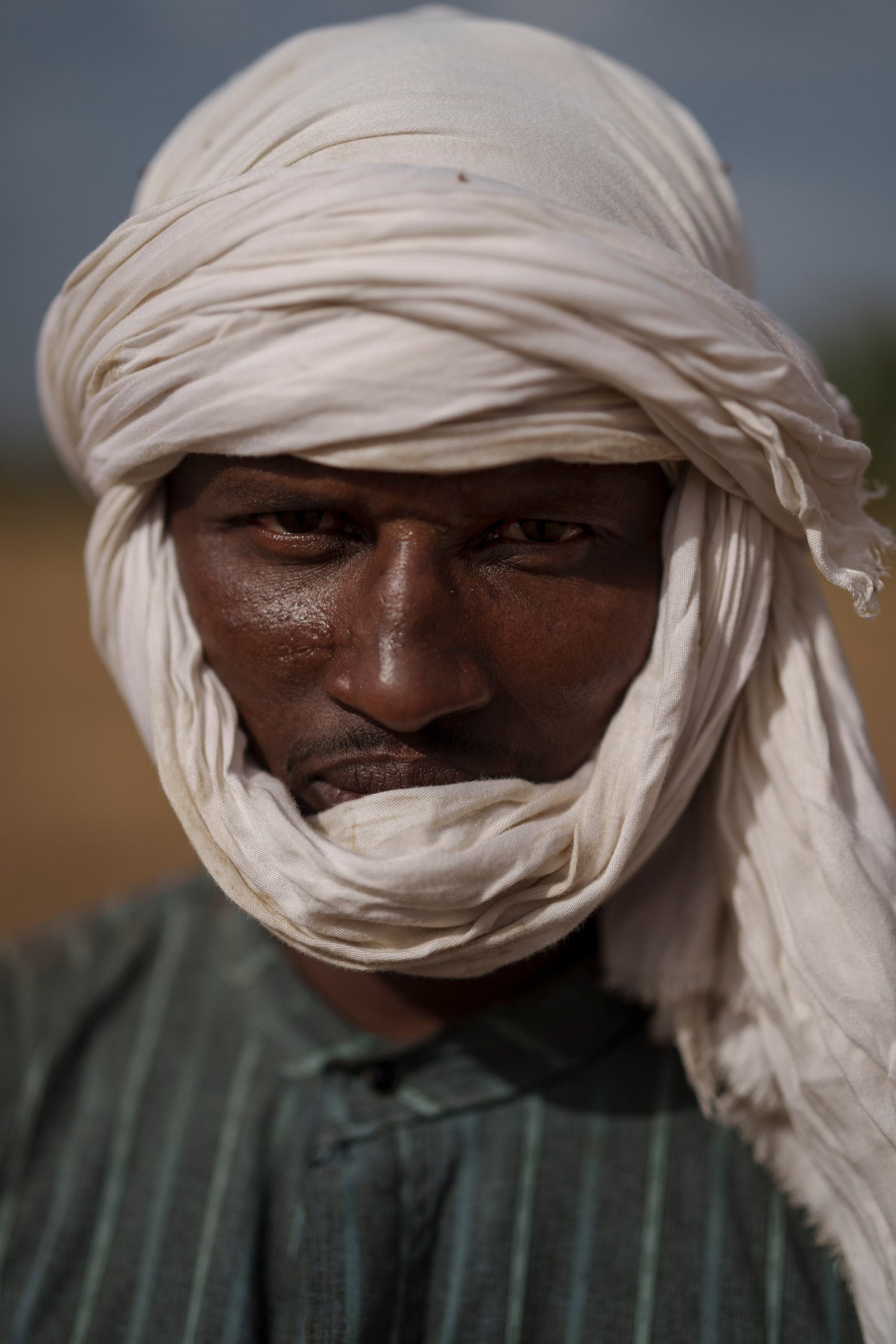  Moussa Ifra Ba, stands for a portrait in the village of Dendoudy Dow, in the Matam region of Senegal, Monday, April 17, 2023. The 28-year-old herder can't imagine any other life. "A village without cows has no soul. ... I love pastoralism to the cor
