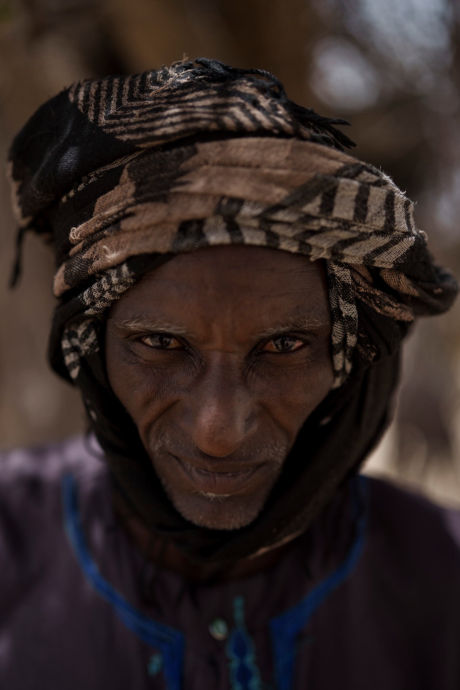  Amadou Djiby, 44, stands for a portrait at a local market near a water station known as Bem Bem, in the Matam region of Senegal, Wednesday, April. 19, 2023. Djiby explains that there are several difficulties working as a herder. The cattle are thirs