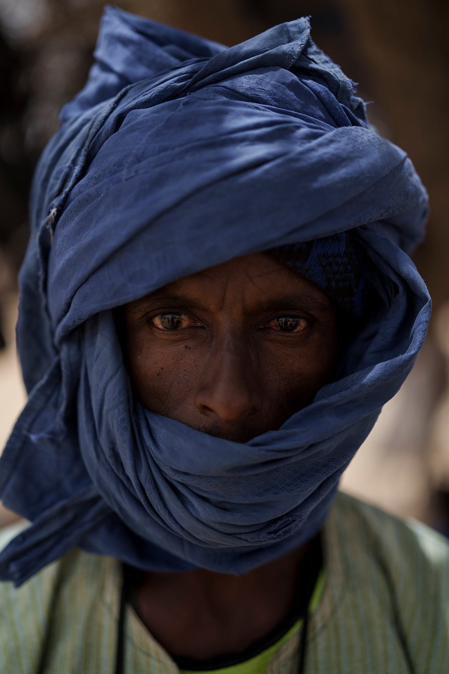  Saydou Kane stands for a portrait at a local market near a water station known as Bem Bem, in the Matam region of Senegal, Wednesday, April. 19, 2023. The 39-year-old herder says one has to know the pleasures and the difficulties in pastoralism. "Th