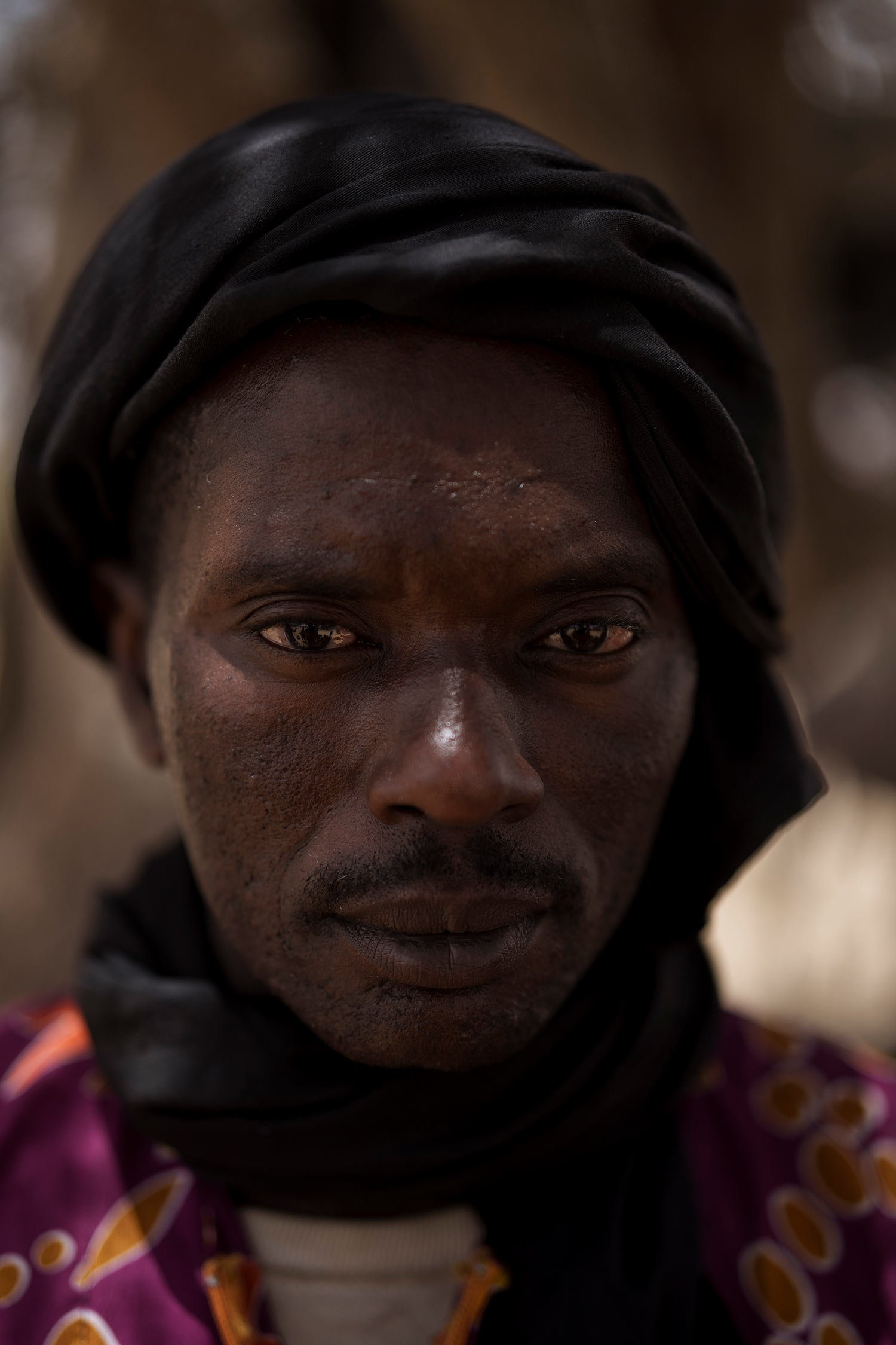  Kebe Pathe Ba stands for a portrait at a local market near a water station known as Bem Bem, in the Matam region of Senegal, Wednesday, April. 19, 2023. The 41-year-old herder says, "It's only the raising of livestock that we like. ... That's all we