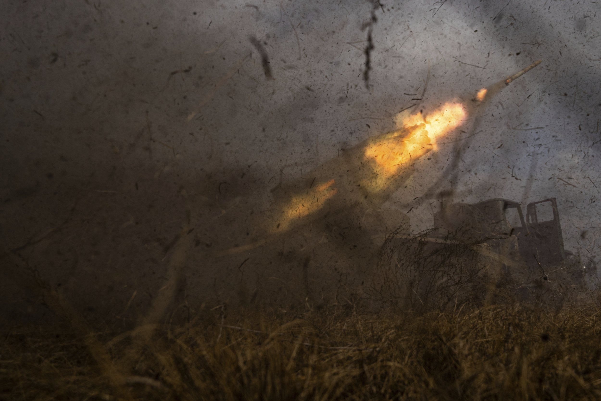  A Ukrainian MSLR BM-21 "Grad" rocket launcher of the 95 Air Assault brigade fires toward Russian positions at the frontline near Kreminna, Ukraine, on March 9, 2023. (AP Photo/Evgeniy Maloletka) 