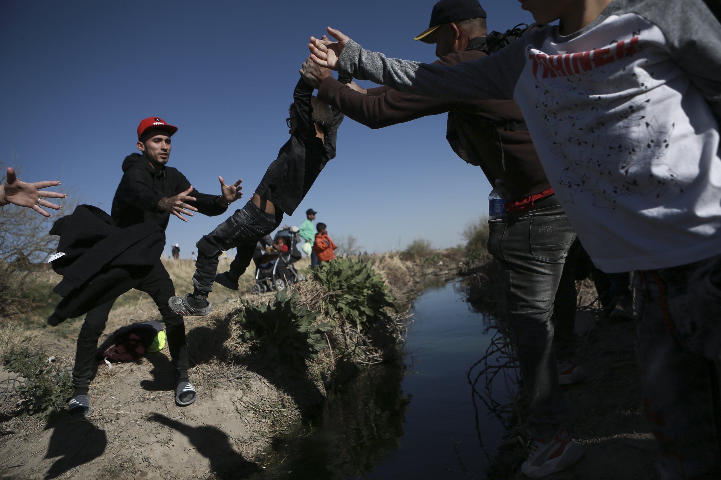  Migrants cross the Rio Grande into the United States from Ciudad Juarez, Mexico, on March 29, 2023, a day after dozens of migrants died in a fire at a migrant detention center in Ciudad Juarez. (AP Photo/Christian Chavez) 