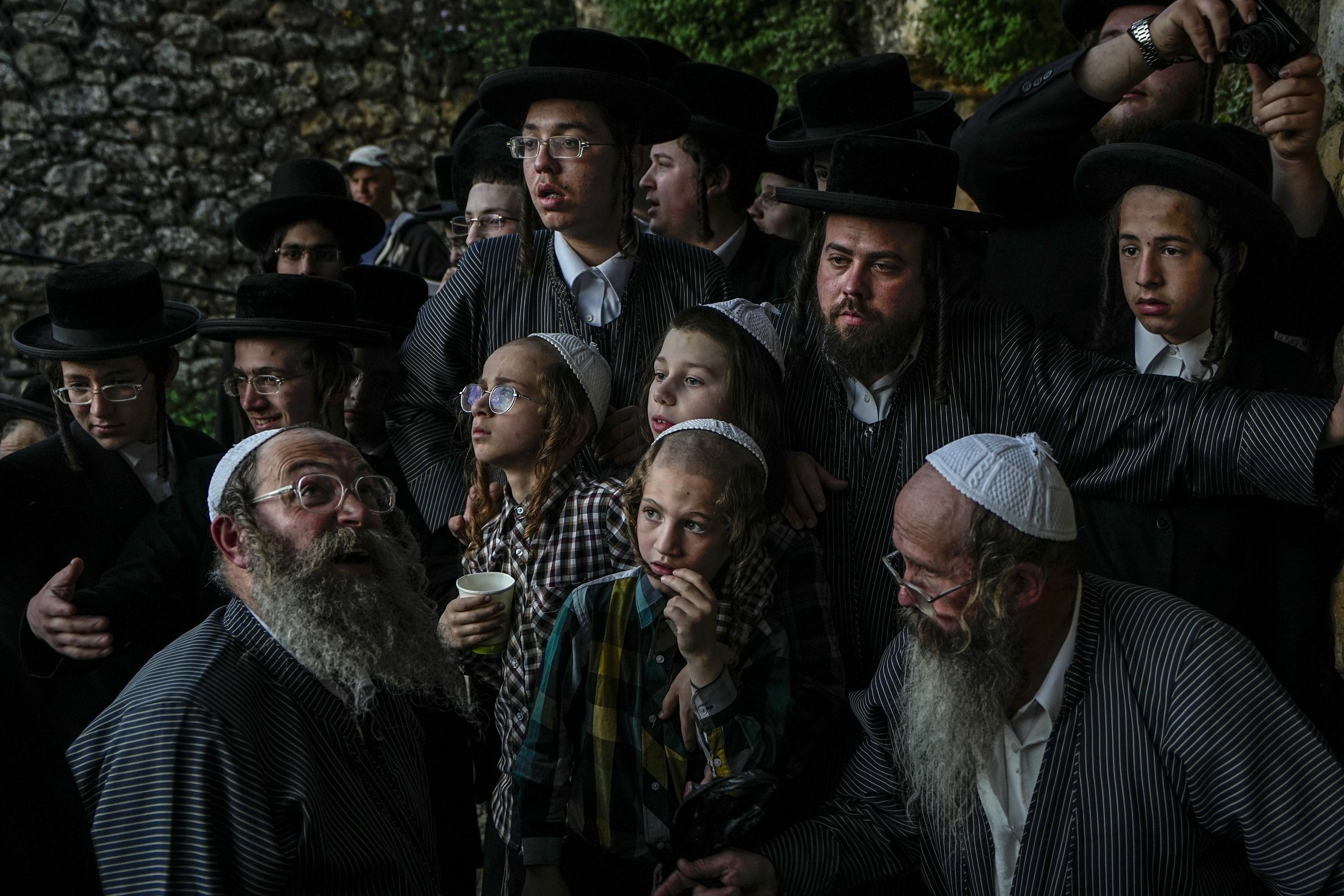  Ultra-Orthodox Jews gather to collect water from a spring to make matzoh, a traditional handmade unleavened bread for Passover, during the Maim Shelanu (Our Water) ceremony at a mountain spring in the outskirts of Jerusalem on April 4, 2023. (AP Pho