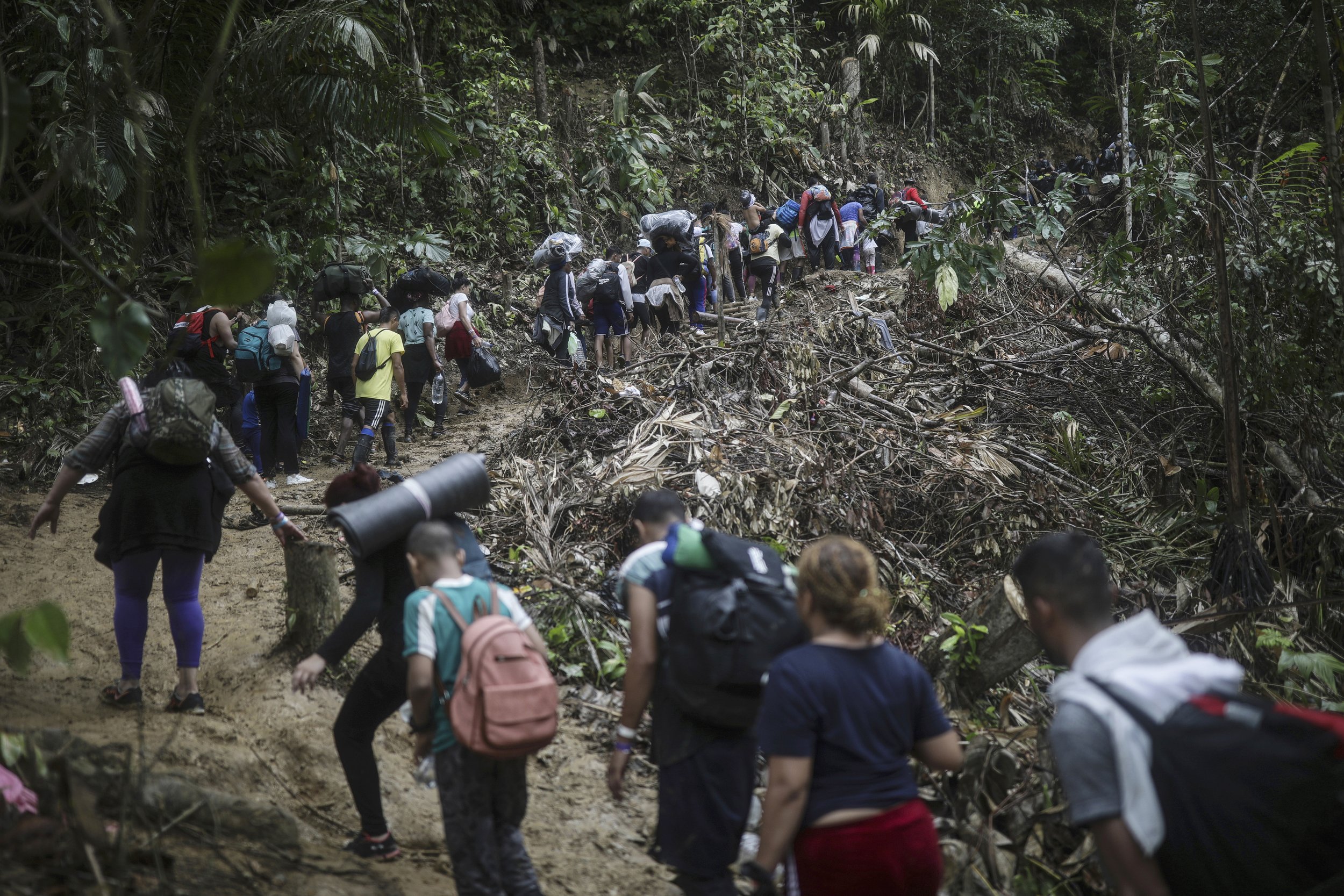  Migrants walk across the Darien Gap from Colombia to Panama on their long and difficult journey to reach the United States, on May 9, 2023. (AP Photo/Ivan Valencia) 