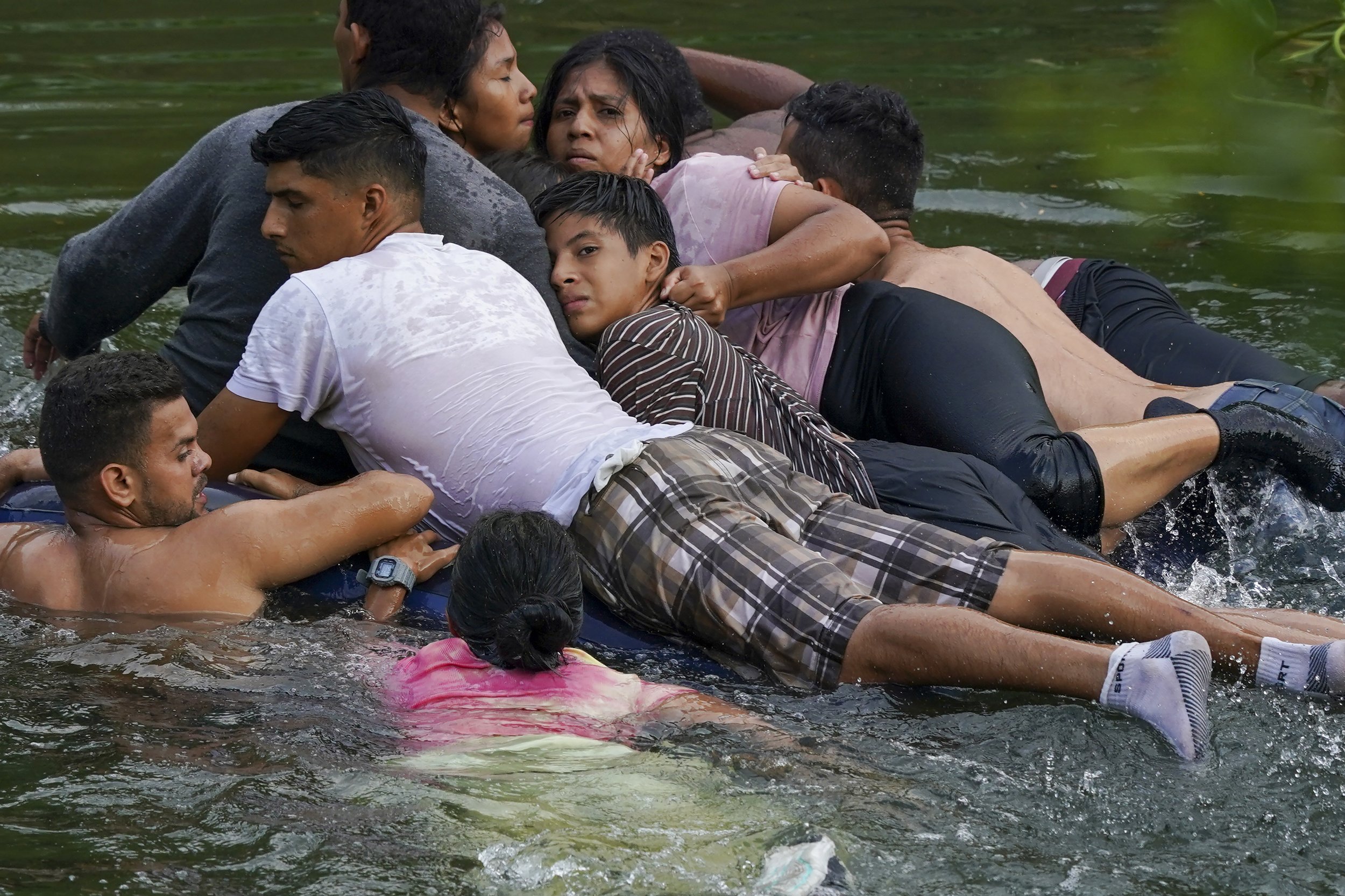  Migrants cross the Rio Bravo on an inflatable mattress into the United States from Matamoros, Mexico, on May 9, 2023. (AP Photo/Fernando Llano) 