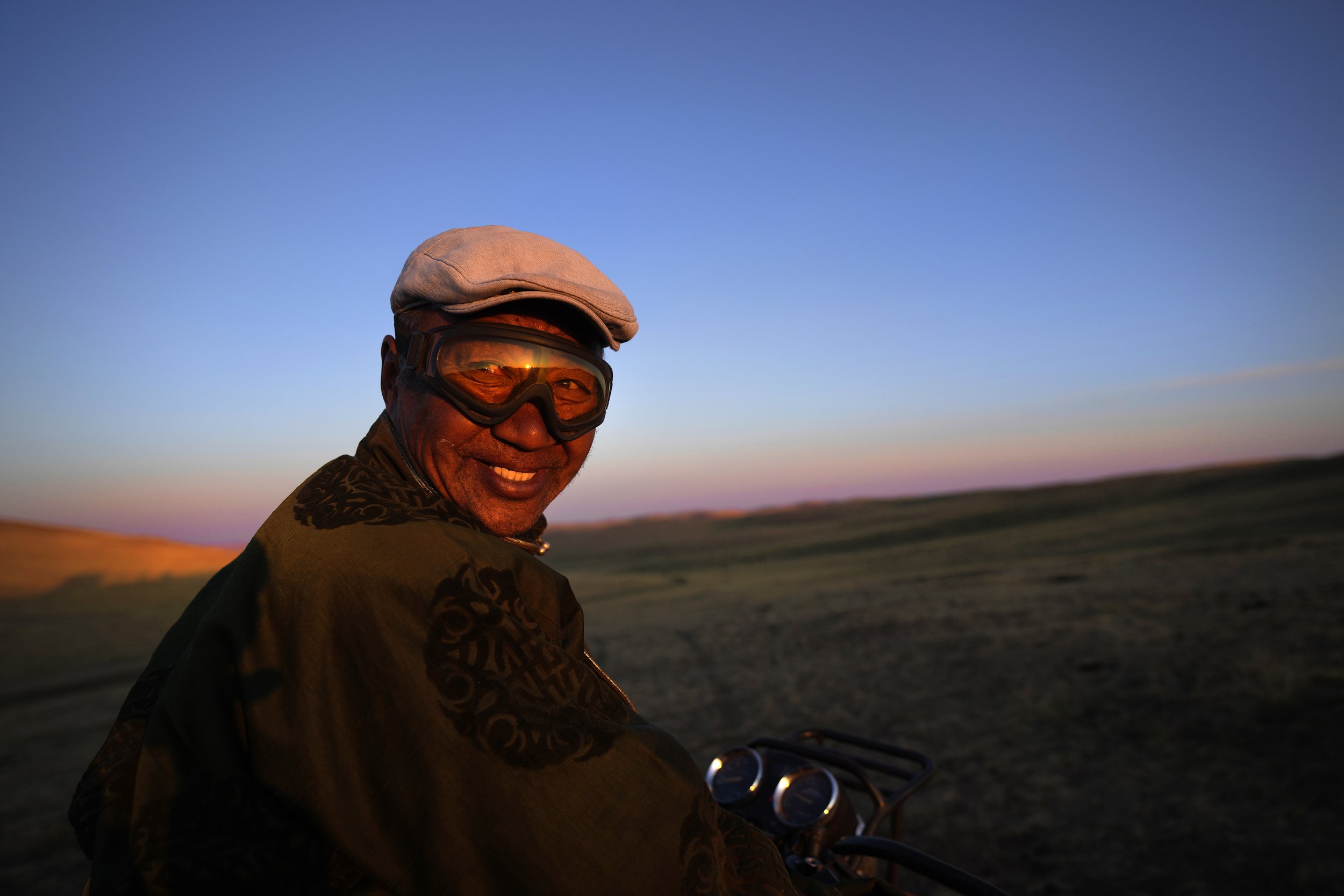  Lkhaebum, 71, sets out at dawn to look for his two hundred horses in the sprawling grasslands of the Munkh-Khaan region of the Sukhbaatar district in southeast Mongolia on May 13, 2023. He recently began using a motorbike to more easily search for h